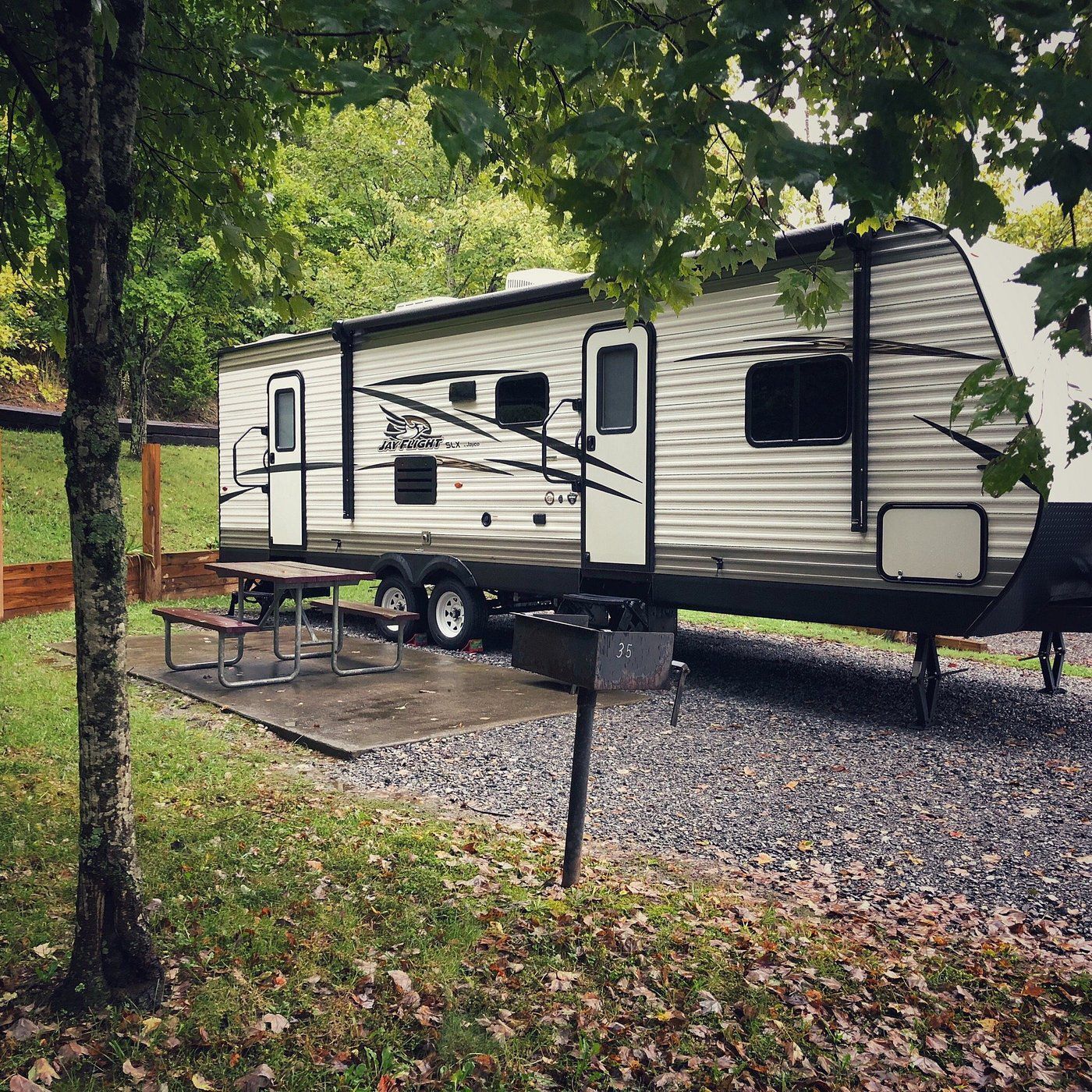Rocky Top Campground RV Park, Blountville, Tennessee, an RV in a lot after a light rain shower