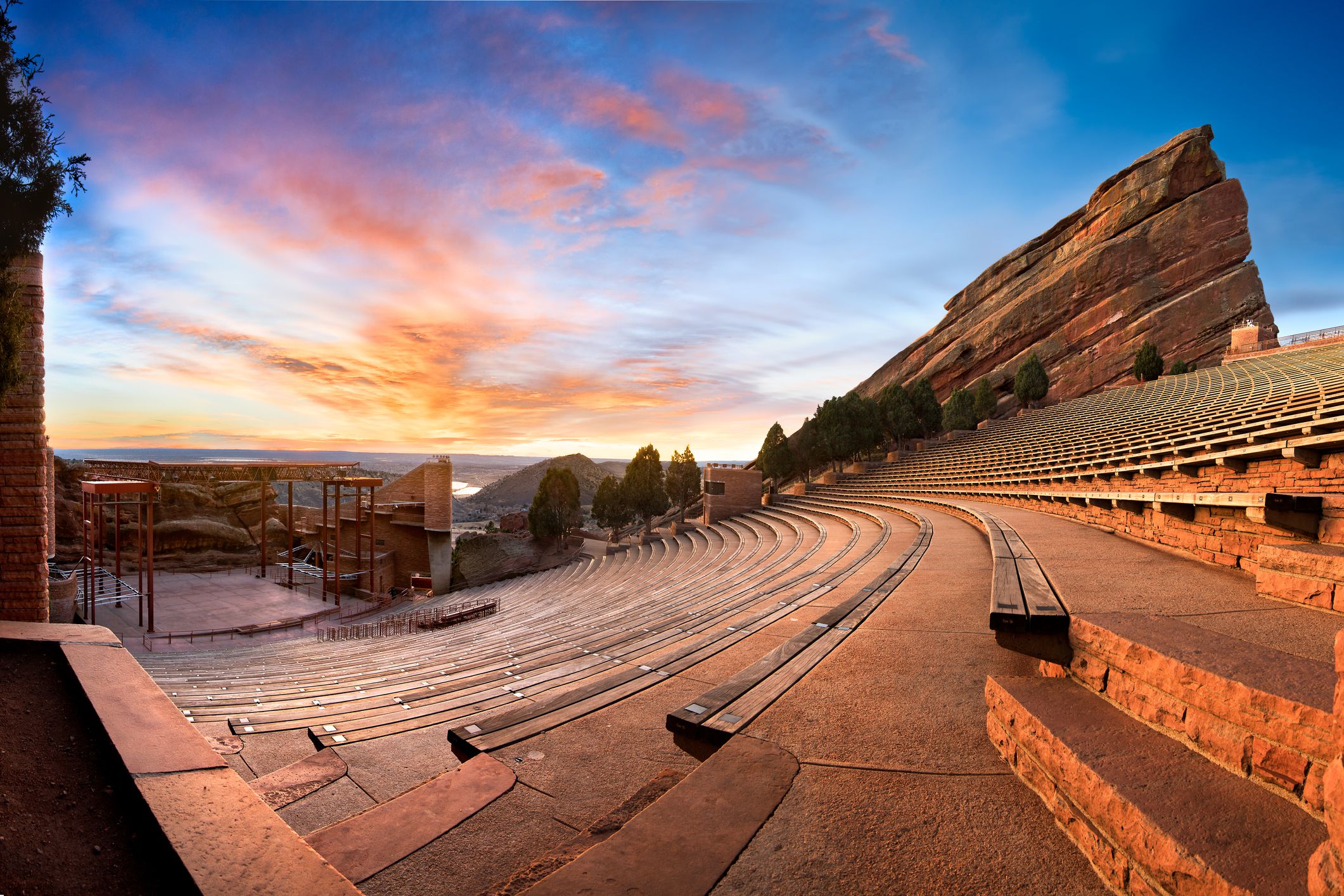 Side-view of seating of Red Rocks Amphitheatre, Morrison, Colorado near Denver during sunrise, large expansive sky