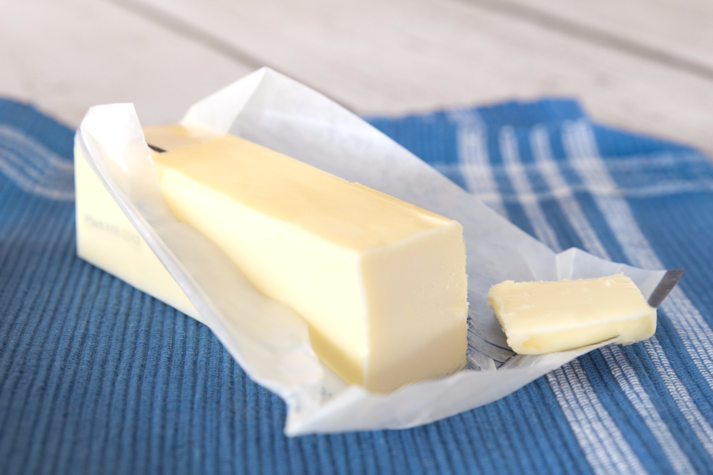 Stick of butter in an opened wrapper