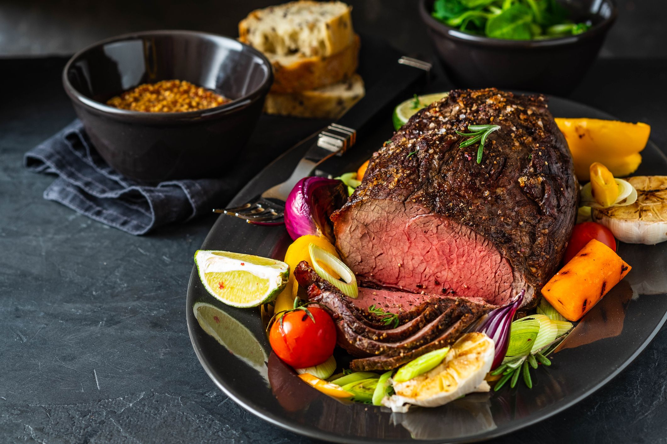 Club Beef steak with pepper sauce and Grilled vegetables on dark wooden background