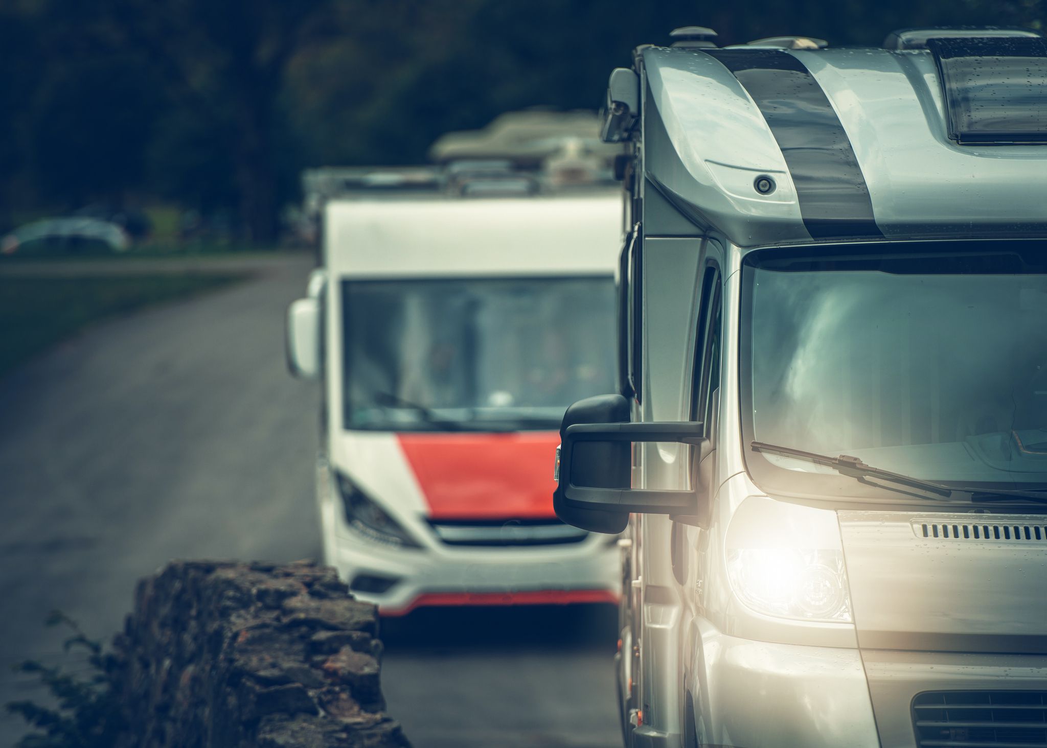 Camper Vans RV Travel. Two Recreational Vehicles on the Road Trip.