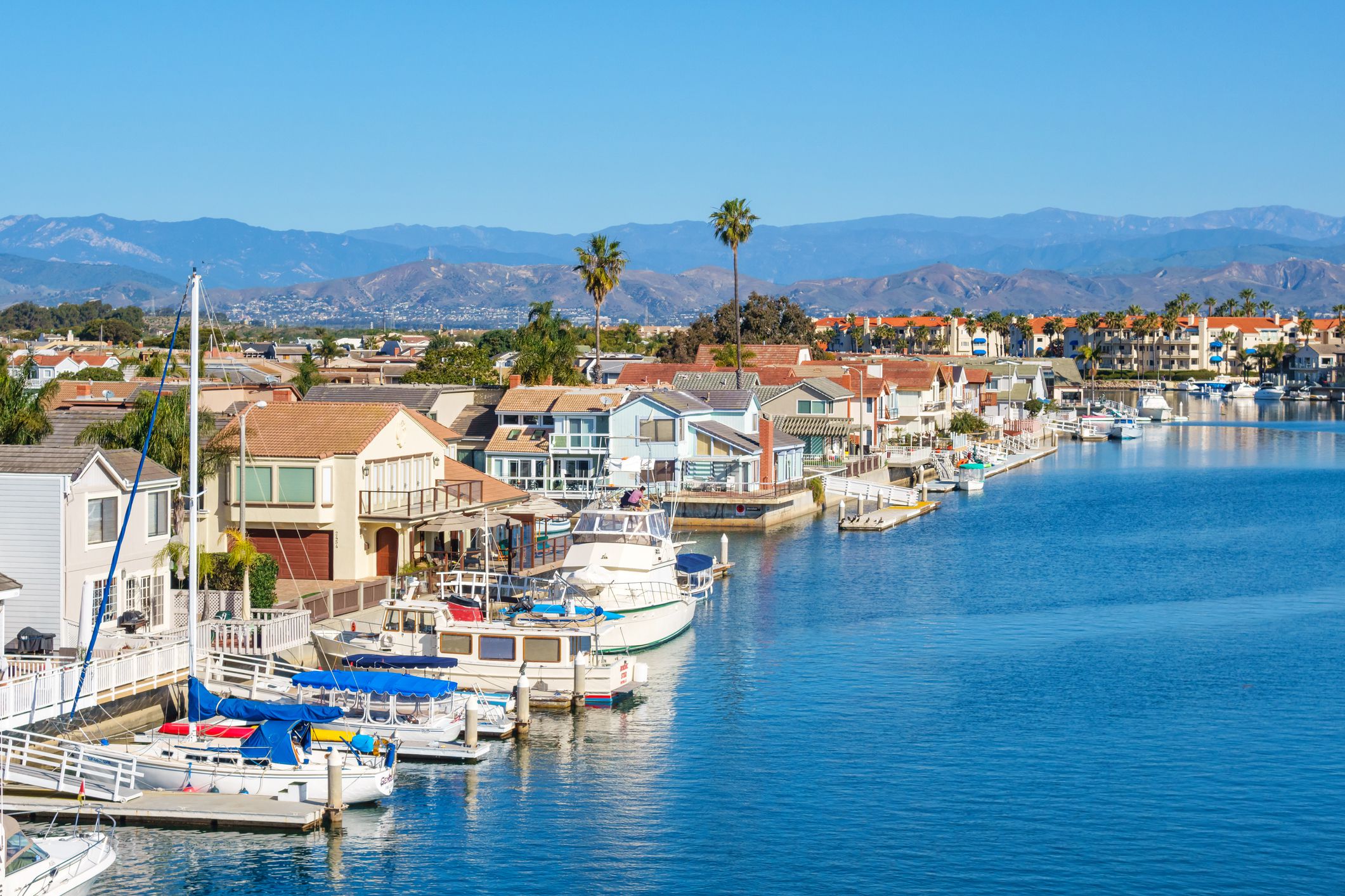 Houses on the waterfront in Oxnard, California, USA on a sunny day.