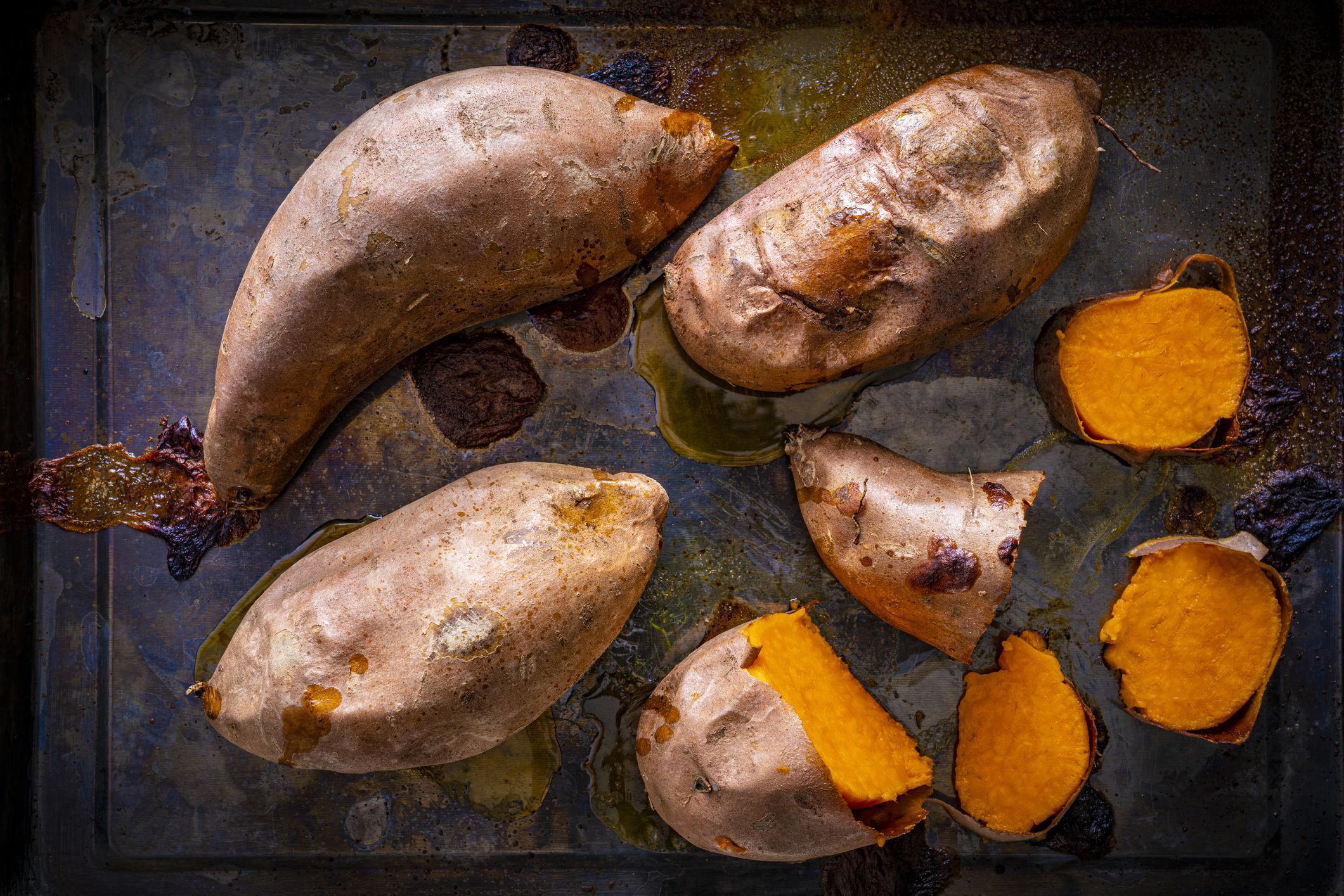 Roasted sweet potato in iron tray oven cooked low key