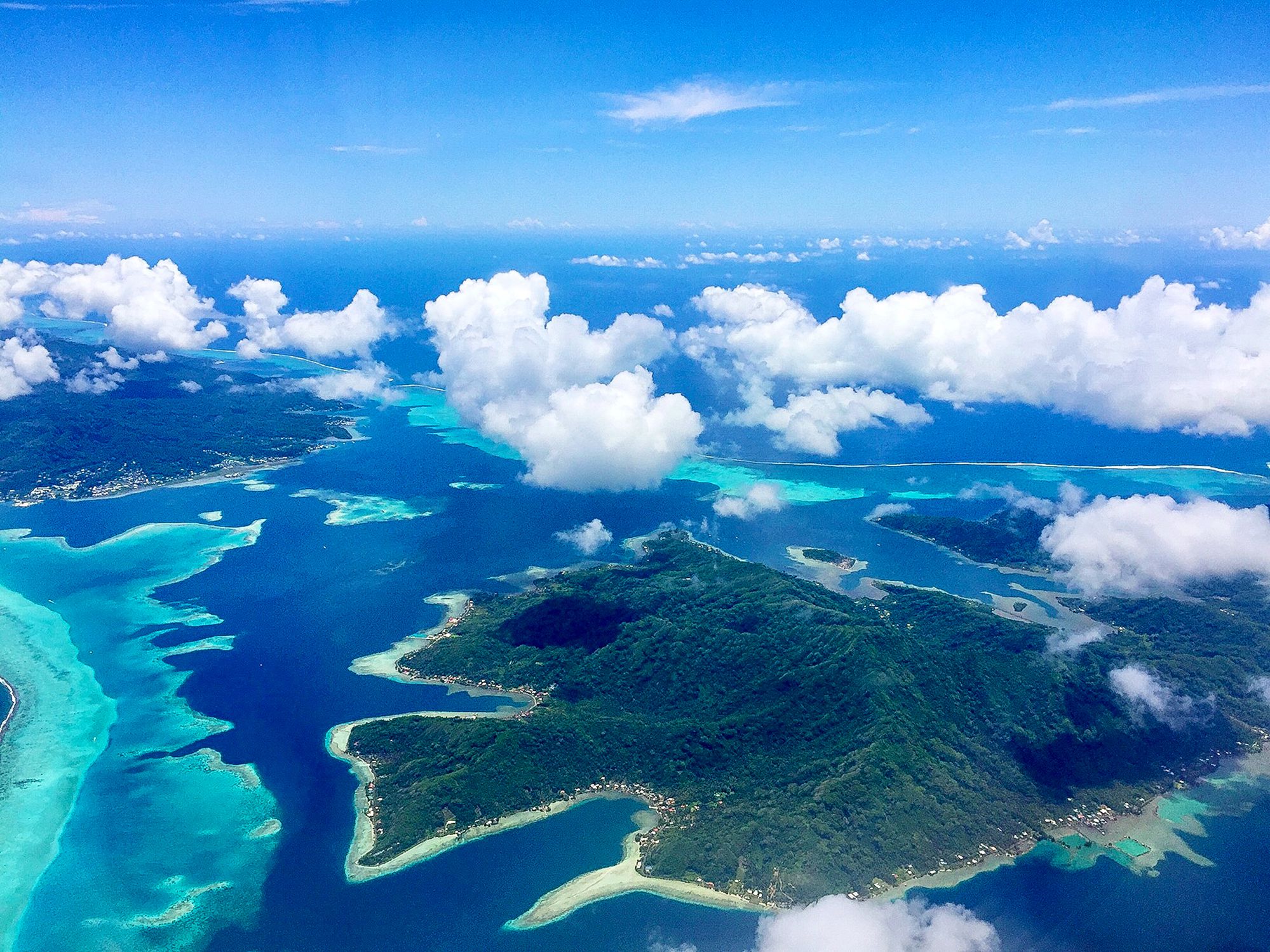 When flying away from Bora Bora island, the Aerial View of the Paradise Bora Bora Island is truly amazing. Here is another beautiful island seen from the air when flying from Bora Bora Island to Tahiti.