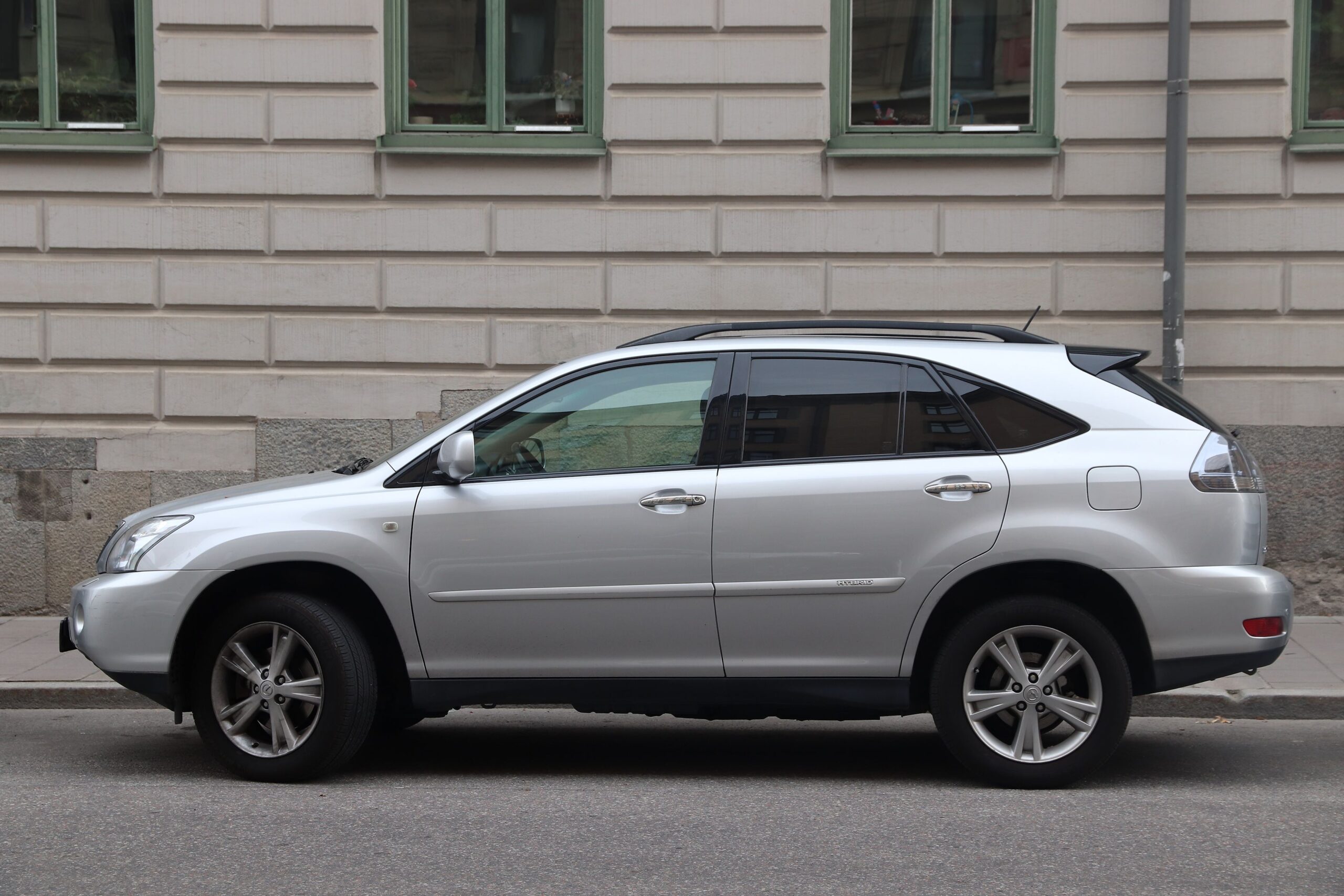 Silver Lexus RS400 hybrid SUV parked in Stockholm, Sweden. There are 4.8 million passenger cars registered in Sweden.