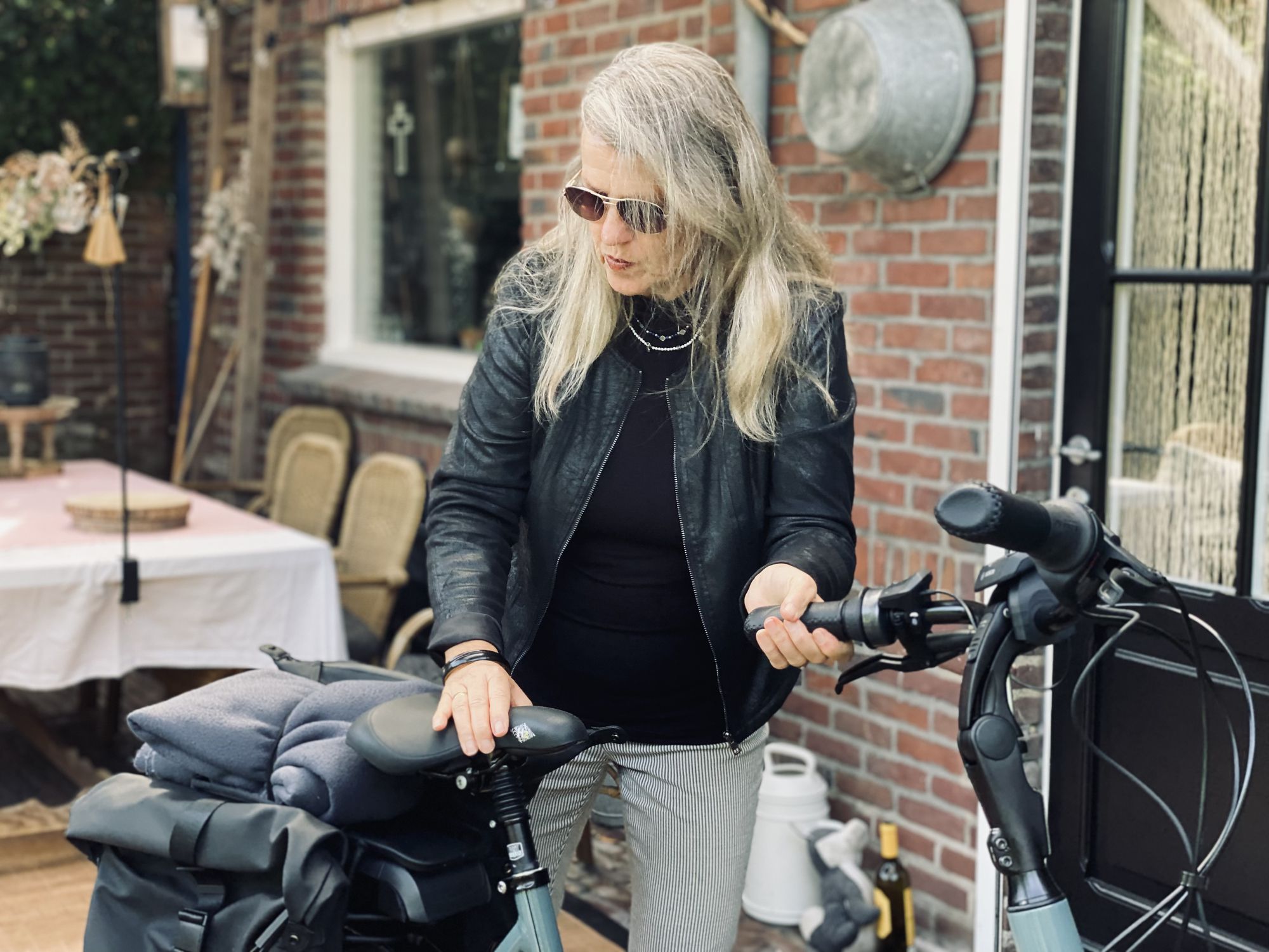 Woman leaving on her e-bike for a tour