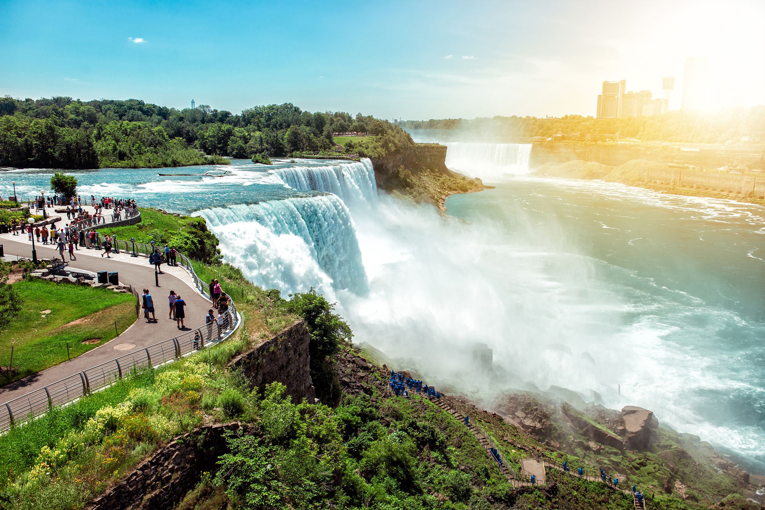 tourists enjoying beautiful view to Niagara Falls during sunny day