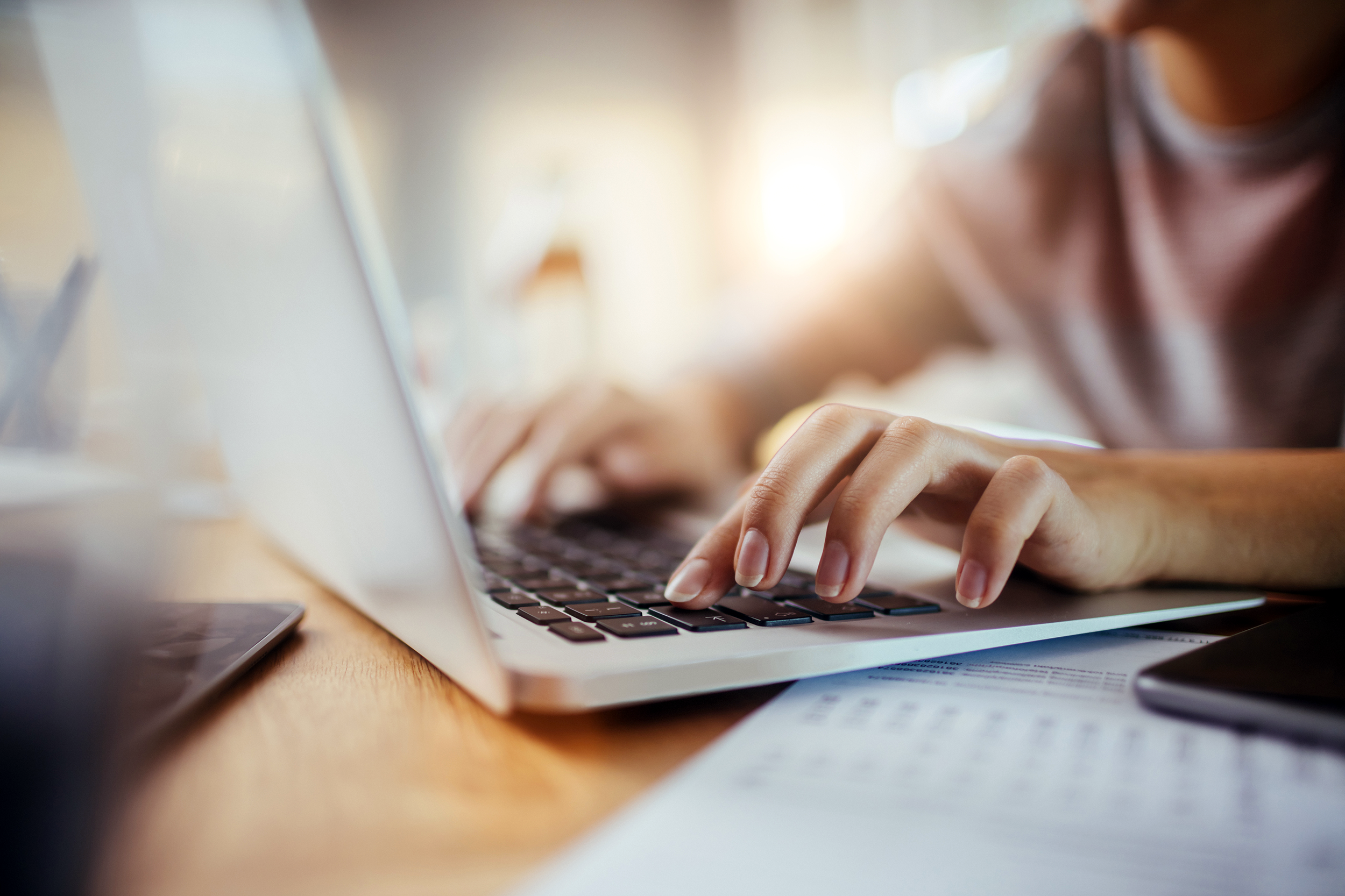 Typing on a laptop