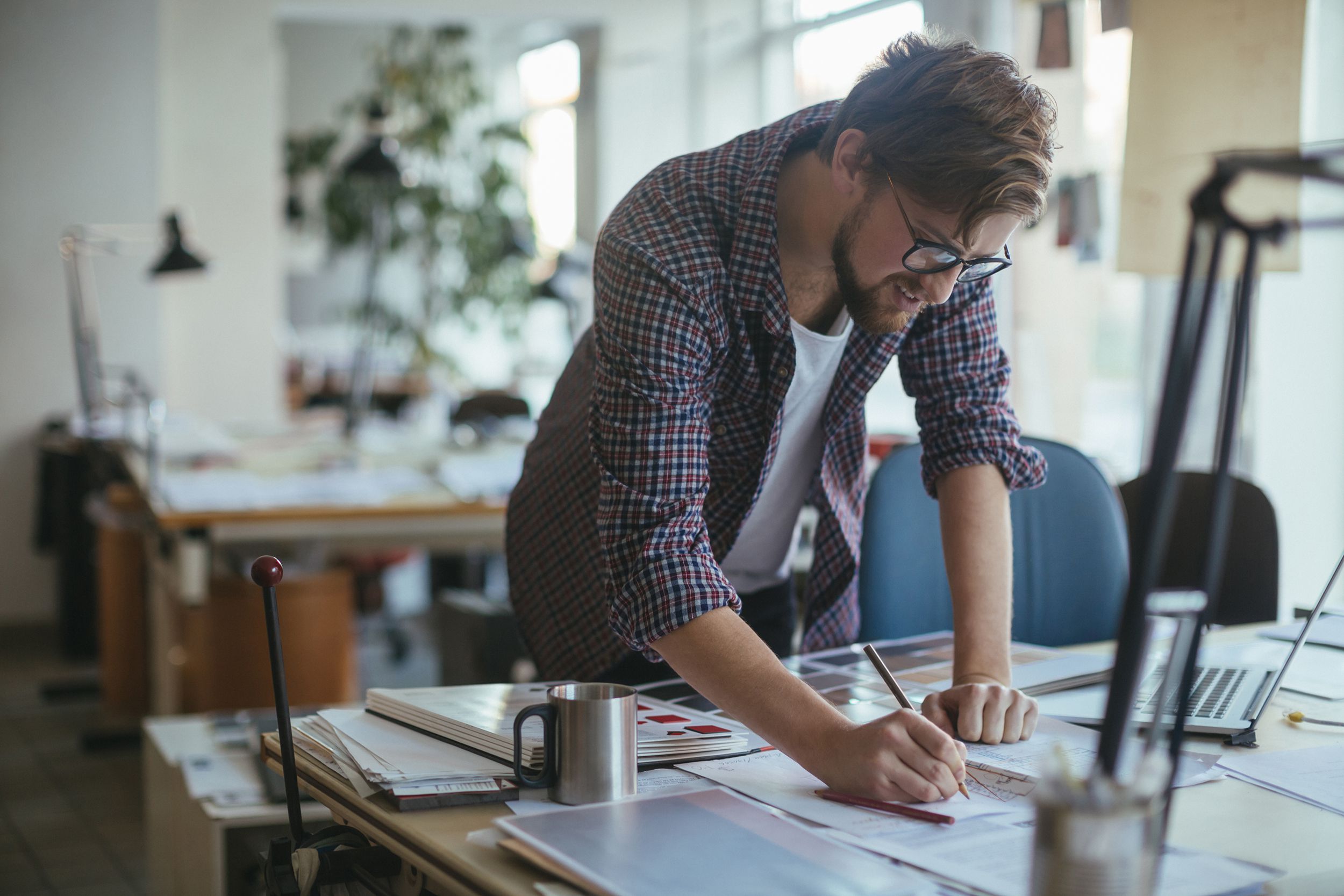 man working on a project at desk