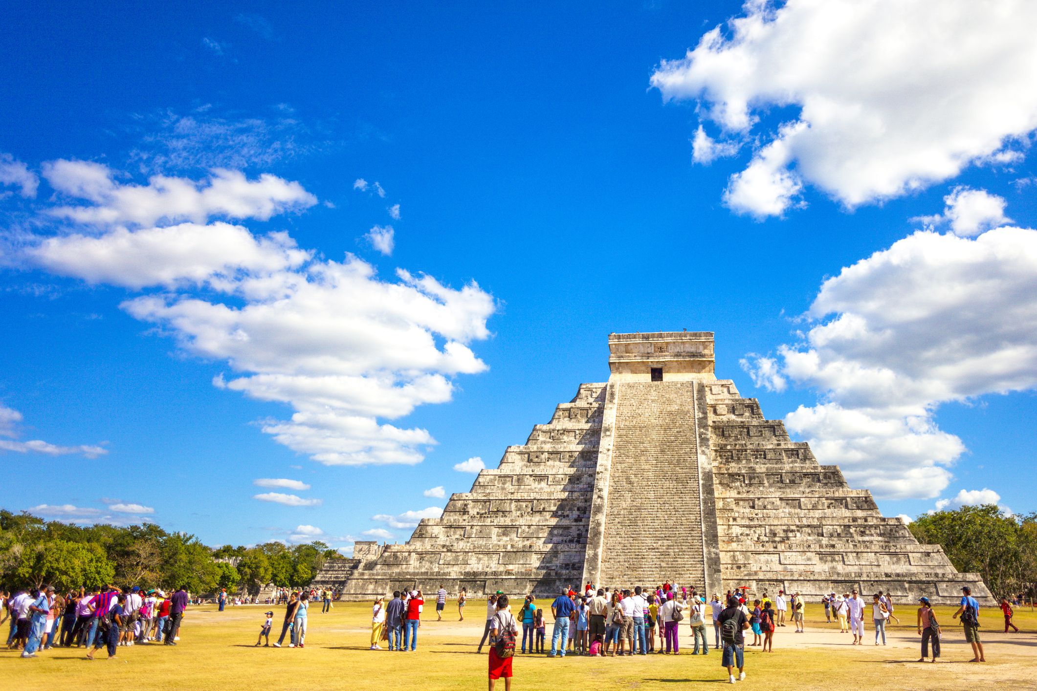 tourists in front of mayan ruins in yucatan region