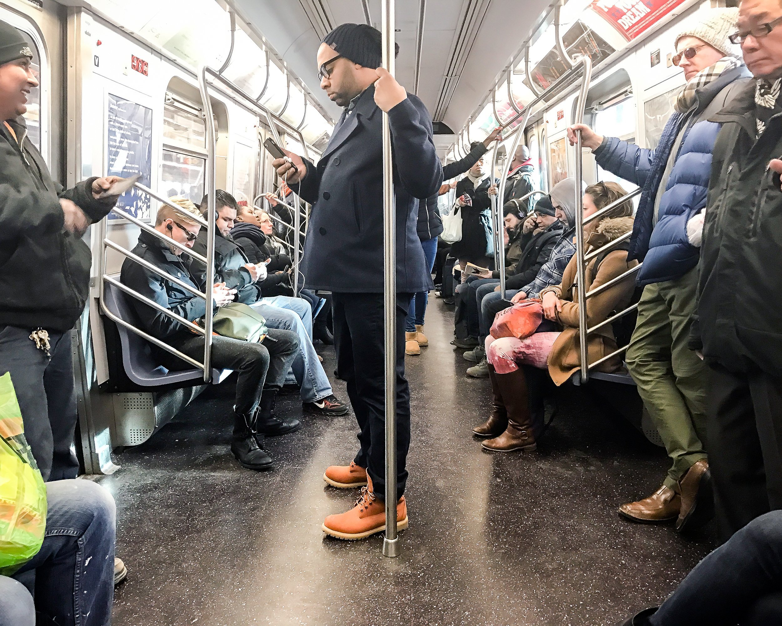 passengers riding MTA subway in NYC