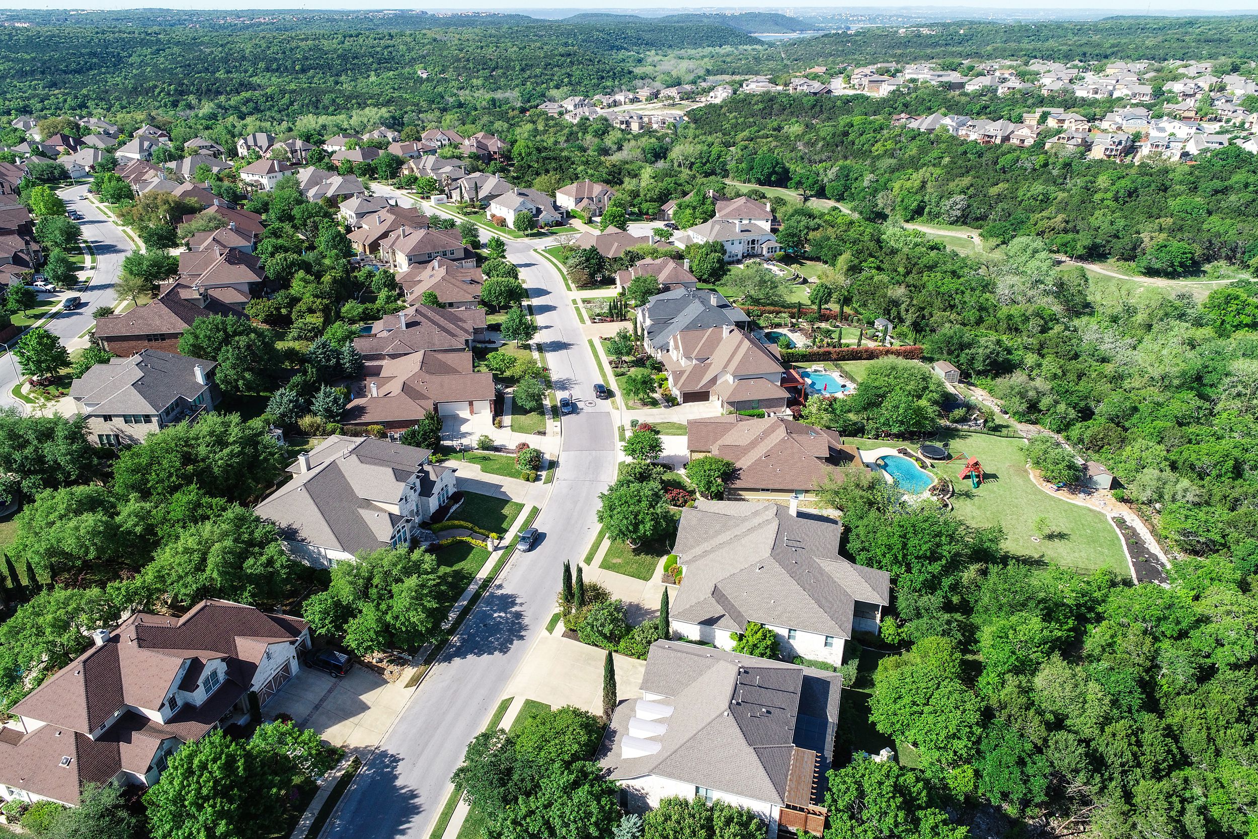 Aerial view of suburb neighborhood in Cedar Park, Texas, sunny summer day