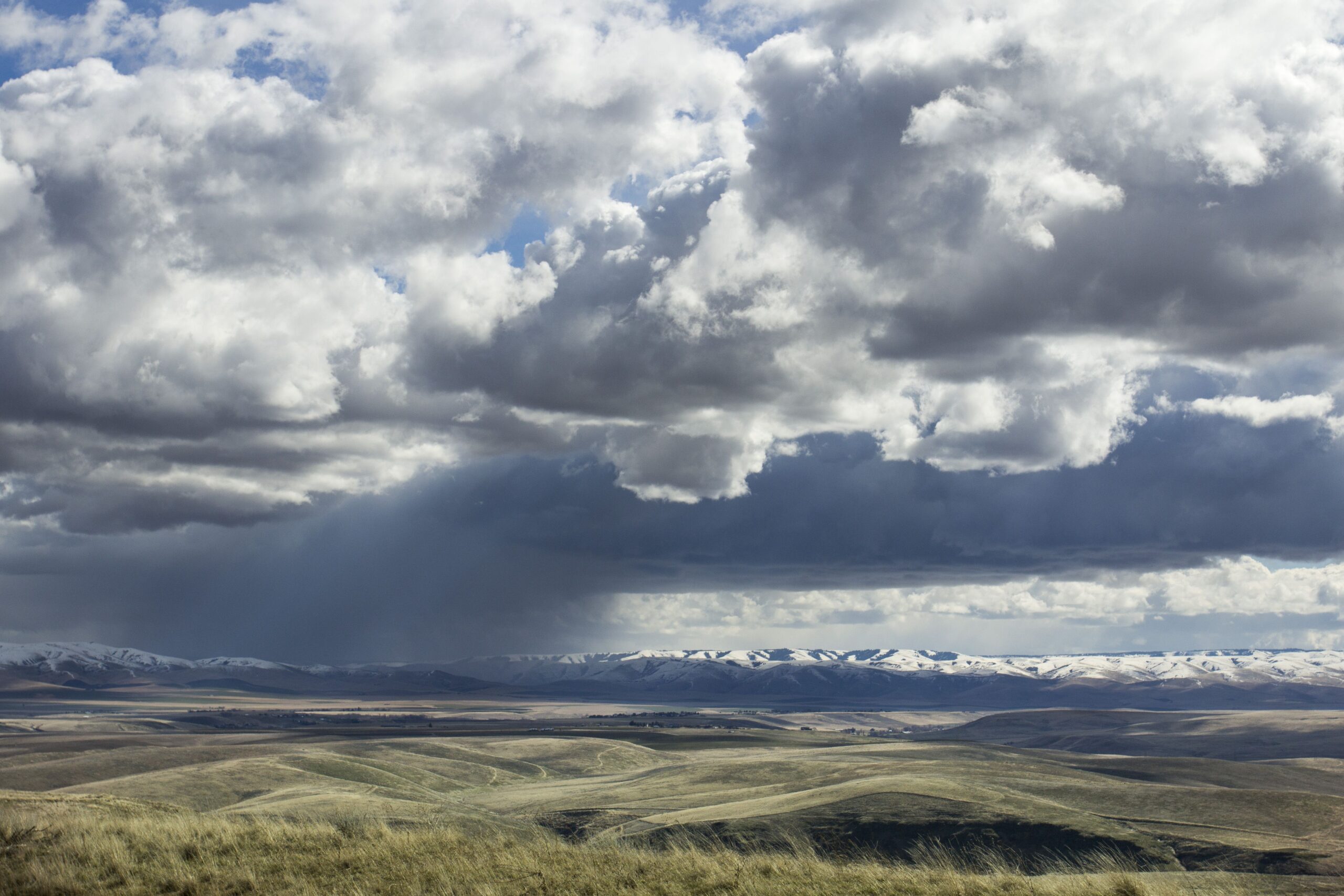 Snow clouds moving across the Blue Mountains. The Blue Mountains are a mountain range in the western United States, located largely in northeastern Oregon and stretching into southeastern Washington.