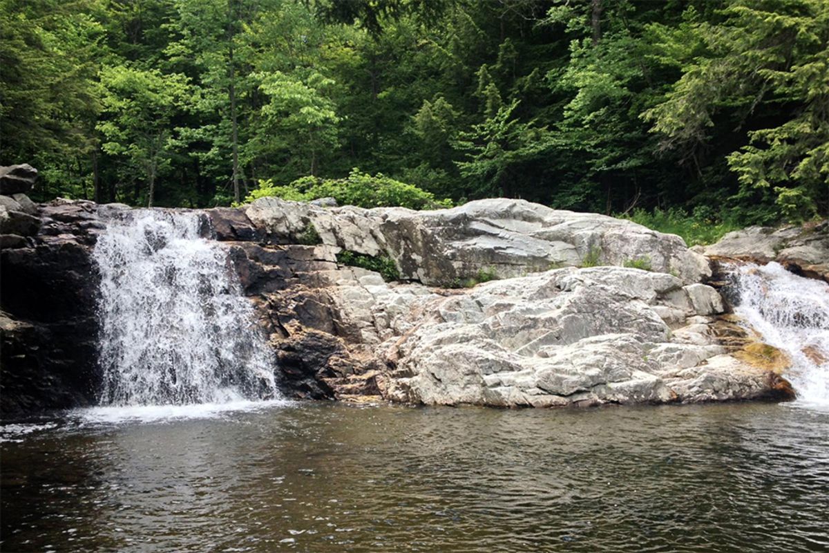 Buttermilk Falls, Ludlow, Vermont with swimming hole in the foreground and forest in the background