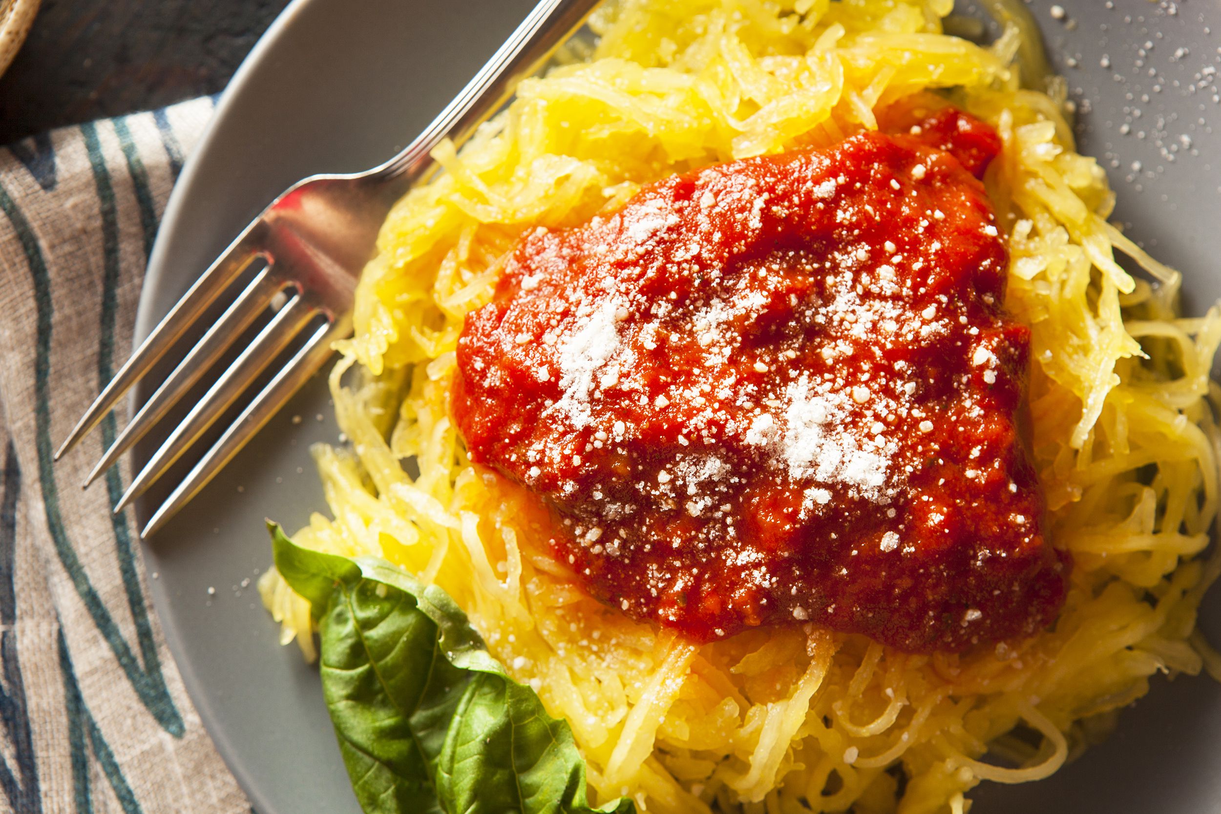 Chicken and Spaghetti Squash on a gray plate with a fork