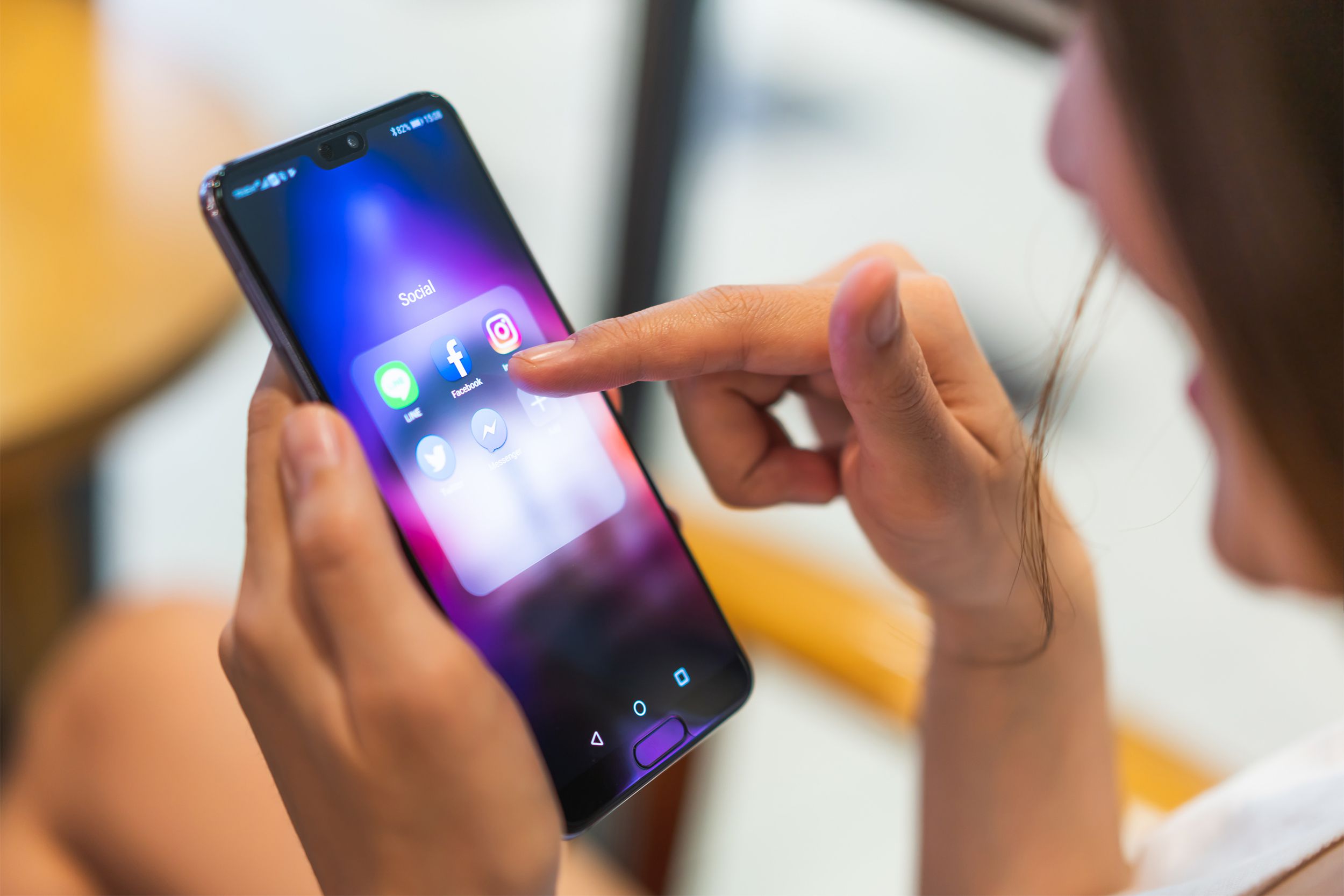 Woman using social media on her phone