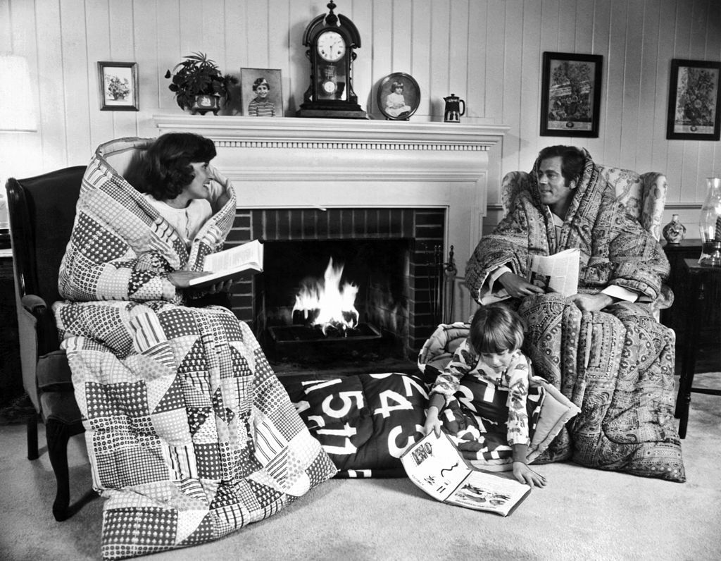 Family Huddled by the Fireplace
