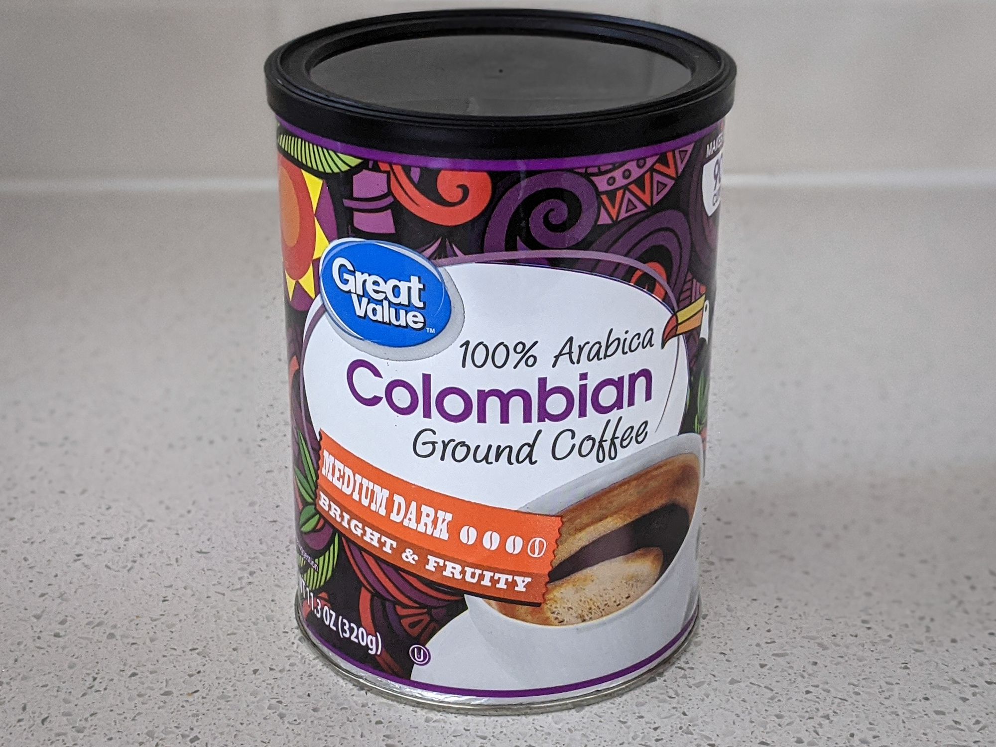 Great Value 100% Arabica Colombian Medium Dark Roast on a beige countertop, with a beige tile wall background