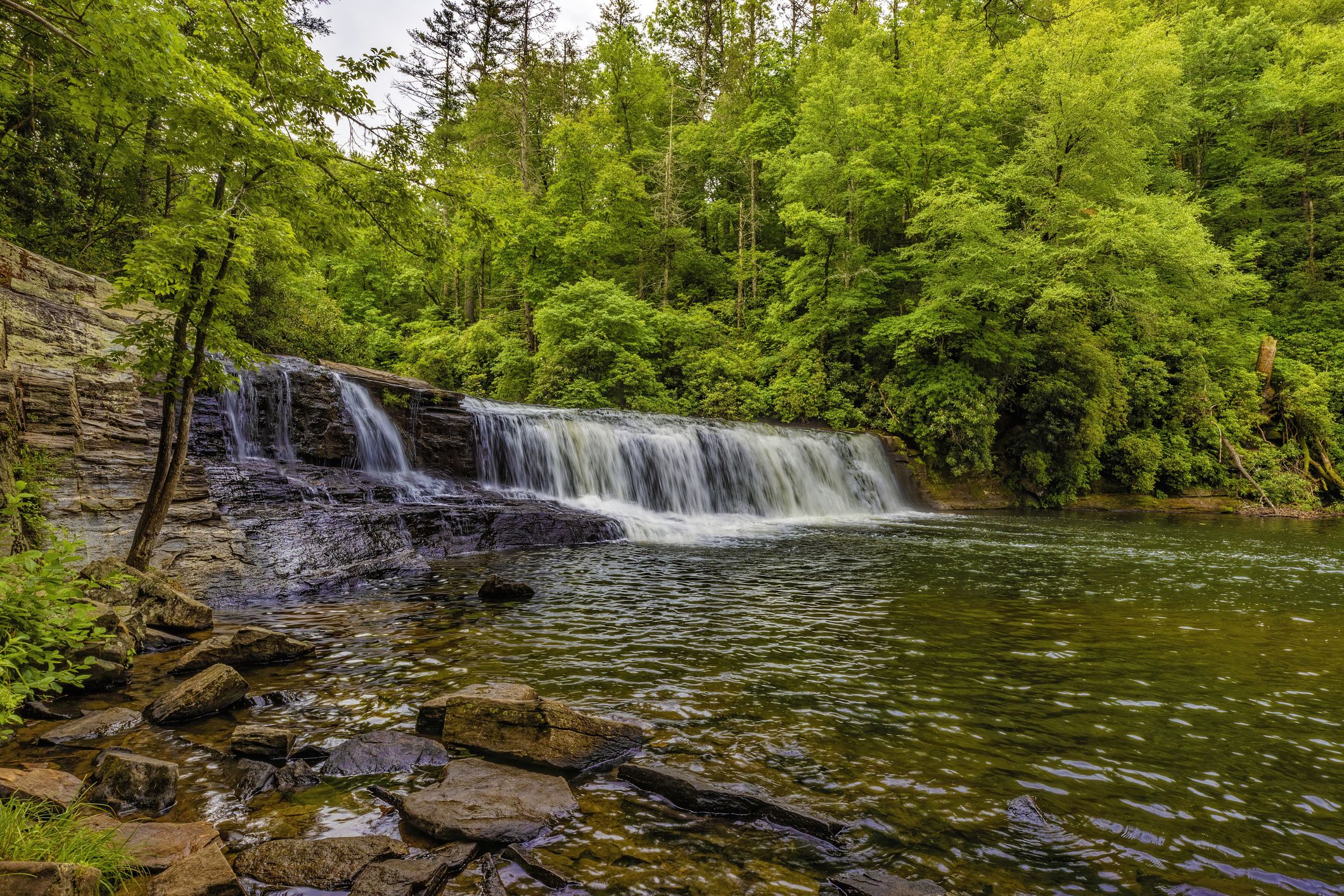 Hooker Falls, DuPont State Recreational Forest, North Carolina falling into Cascade Lake with forest in background