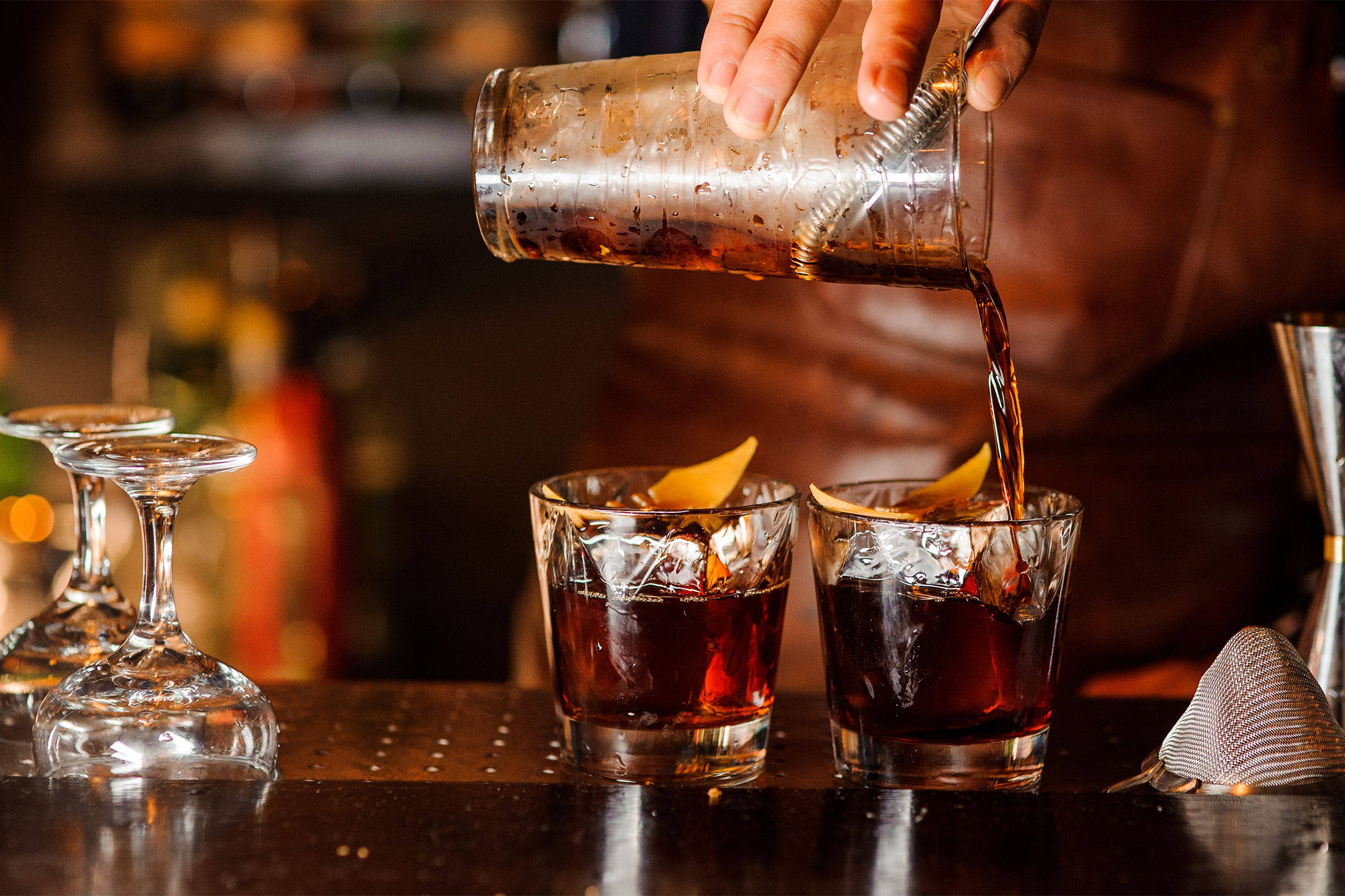 Bartender pouring drinks