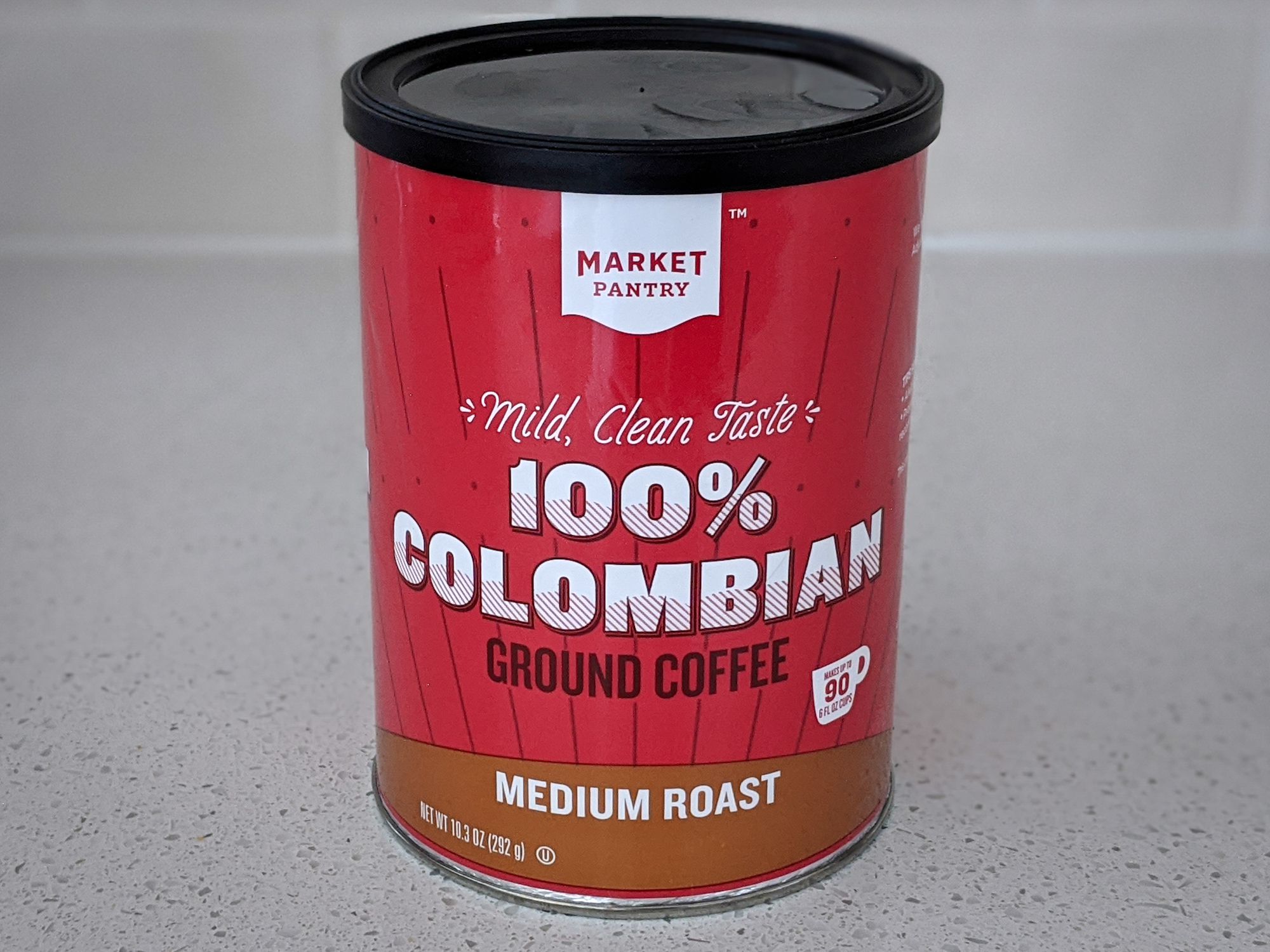 Market Pantry Columbian Medium Roast on a beige countertop, with a beige tile wall background