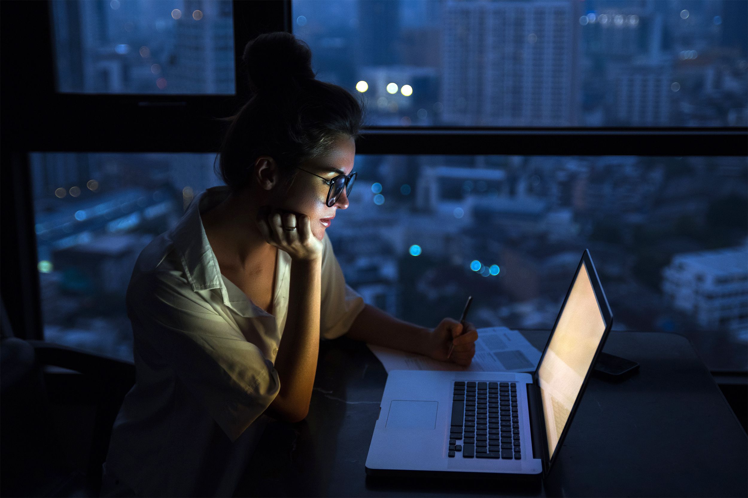 Woman working late at the office