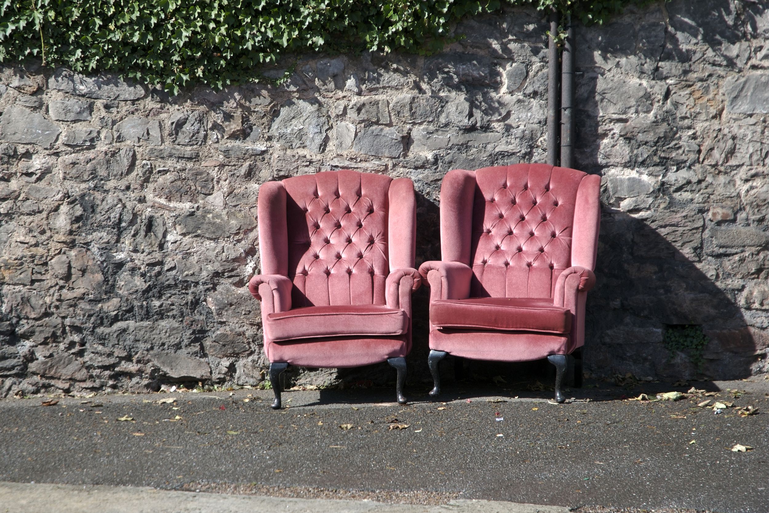 Pink chairs on the sidewalk