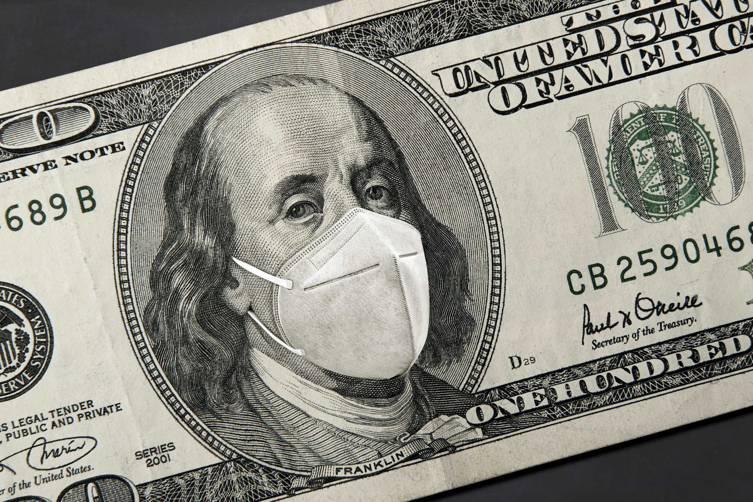 dollar bill with covid-19 mask