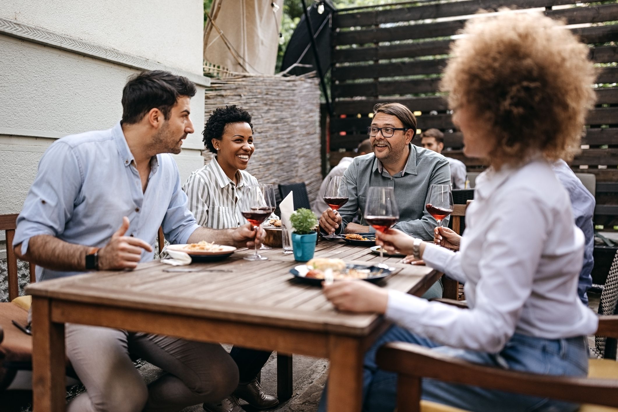 Group of happy business people having a lunch in a restaurant.