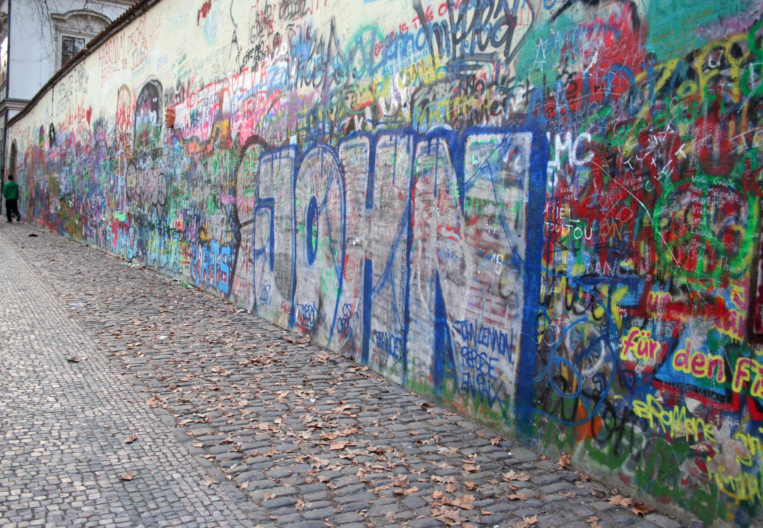 Image of John Lennon Wall in Prague, Czech Republic. This wall has been graffitied many times over by people from all over the world passing through wanting to honor John Lennon.