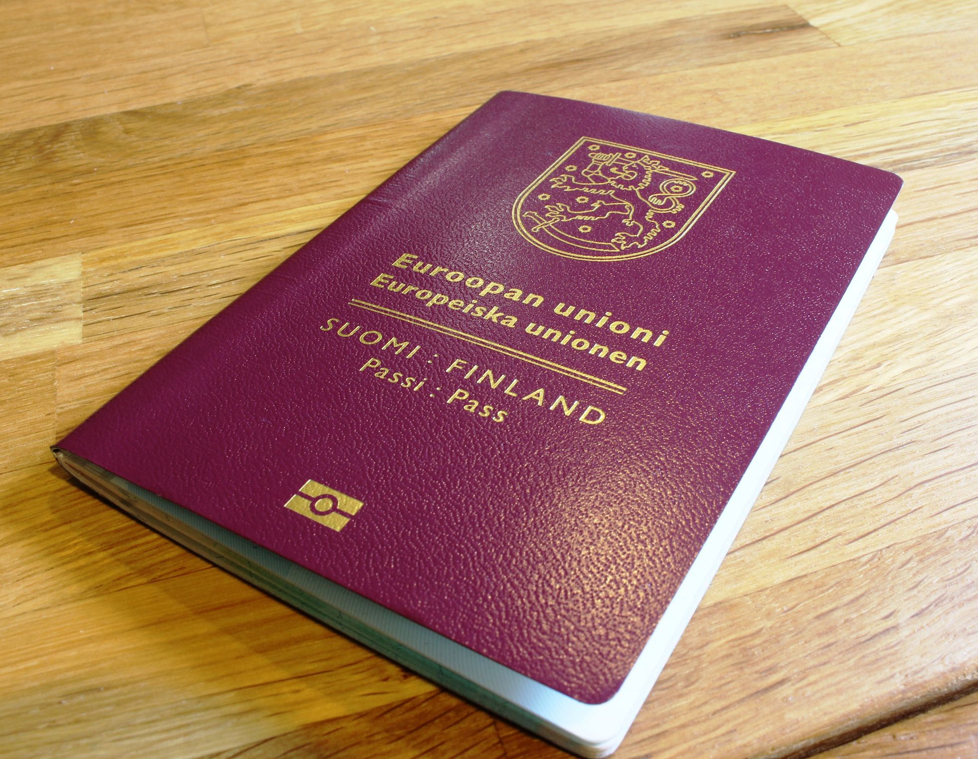 New Finnish/European passport on a table.