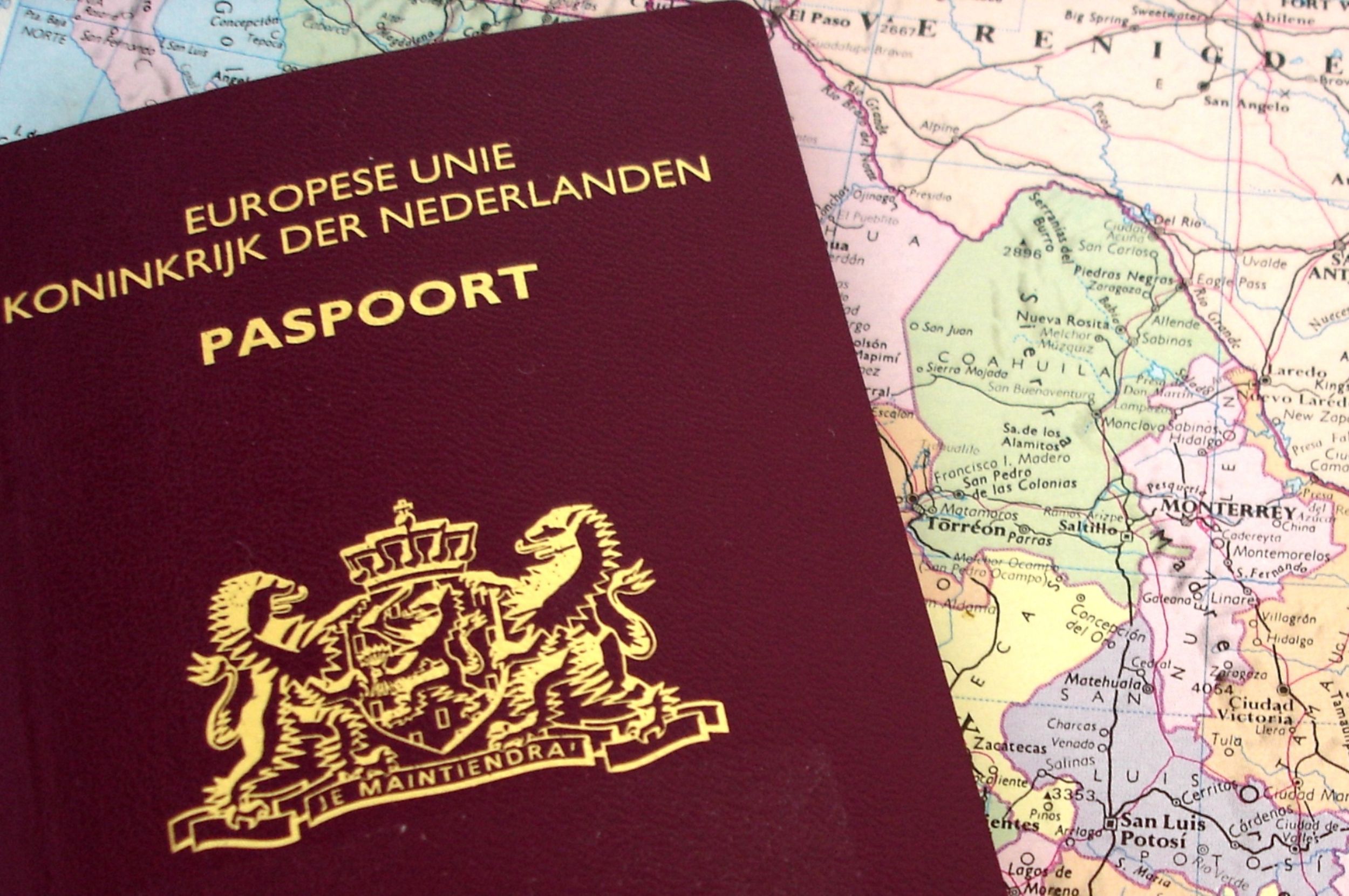 dutch passport on a map