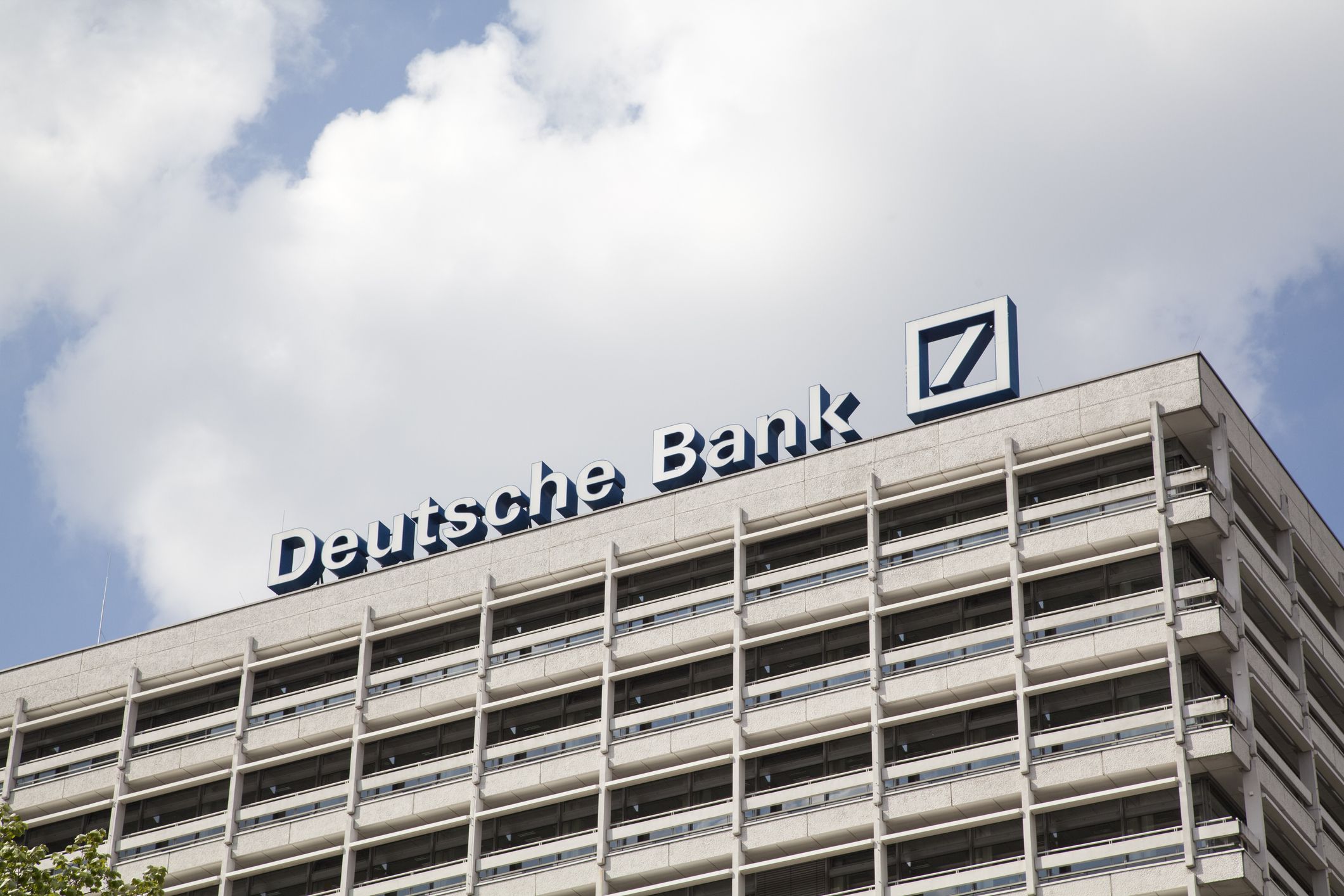Berlin, Germany - April 26, 2014: Deutsche Bank Building in the city centre of Berlin. Close-up of the Name and logo on the top of the building