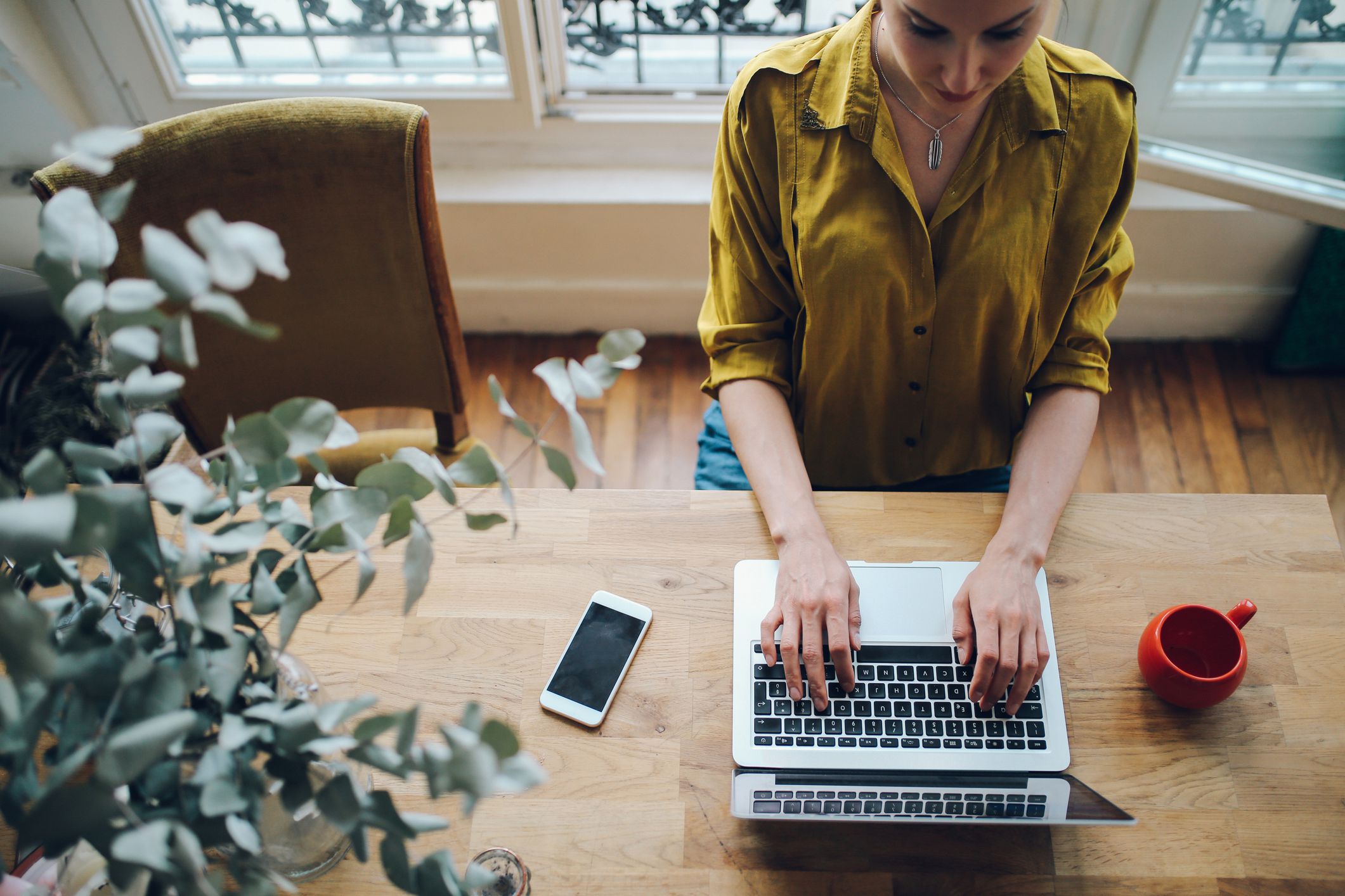 woman typing on laptop