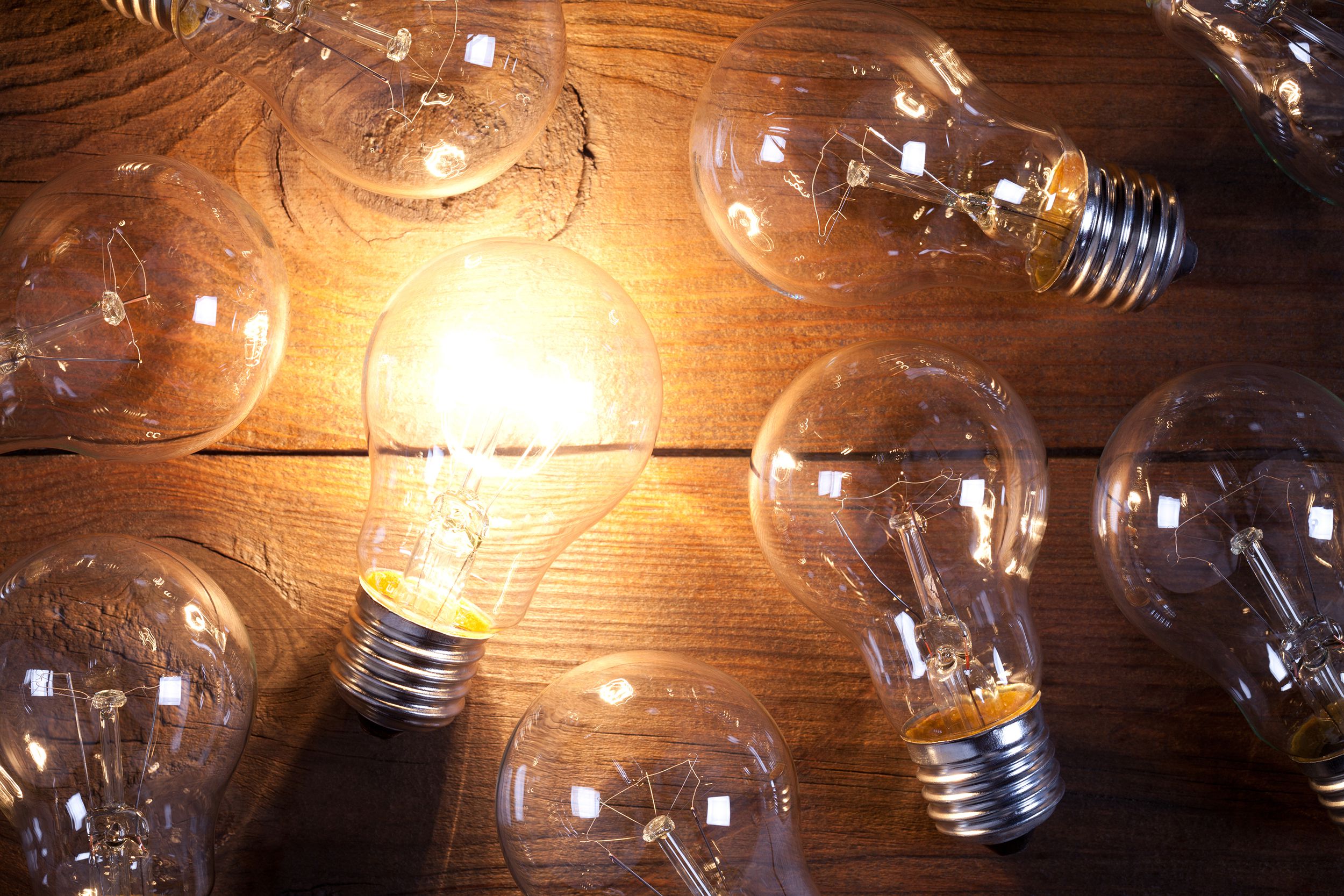 vintage incandescent bulbs on old wooden table