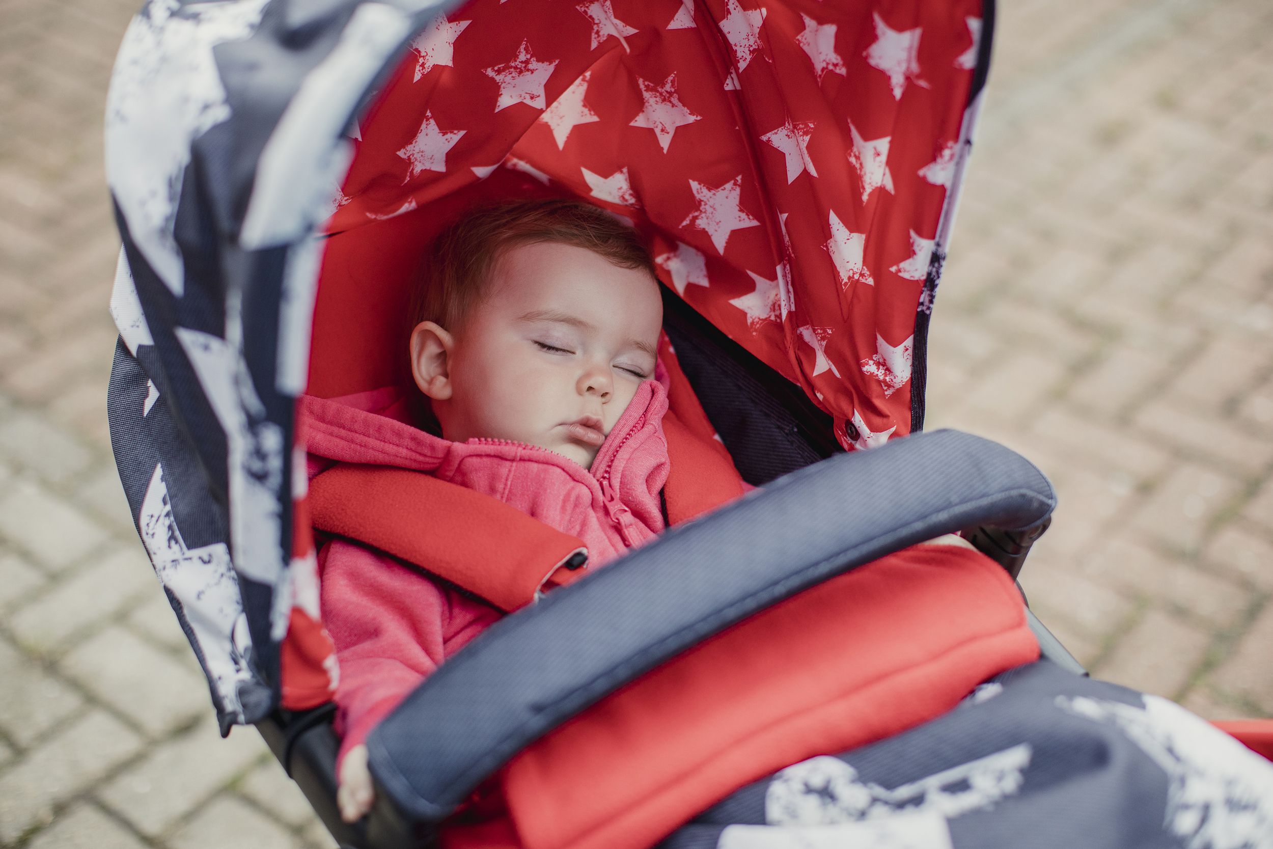 baby asleep in stroller