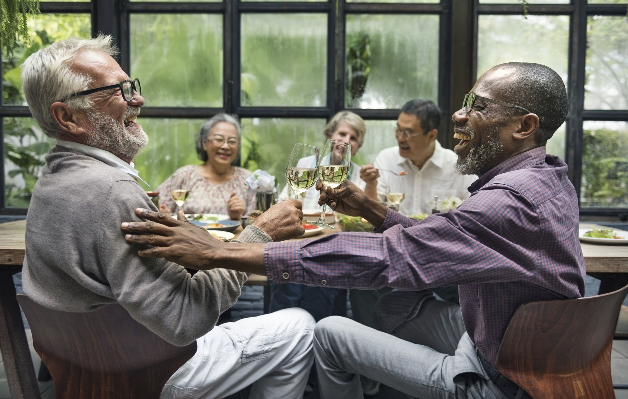 Mature friends at a dinner party
