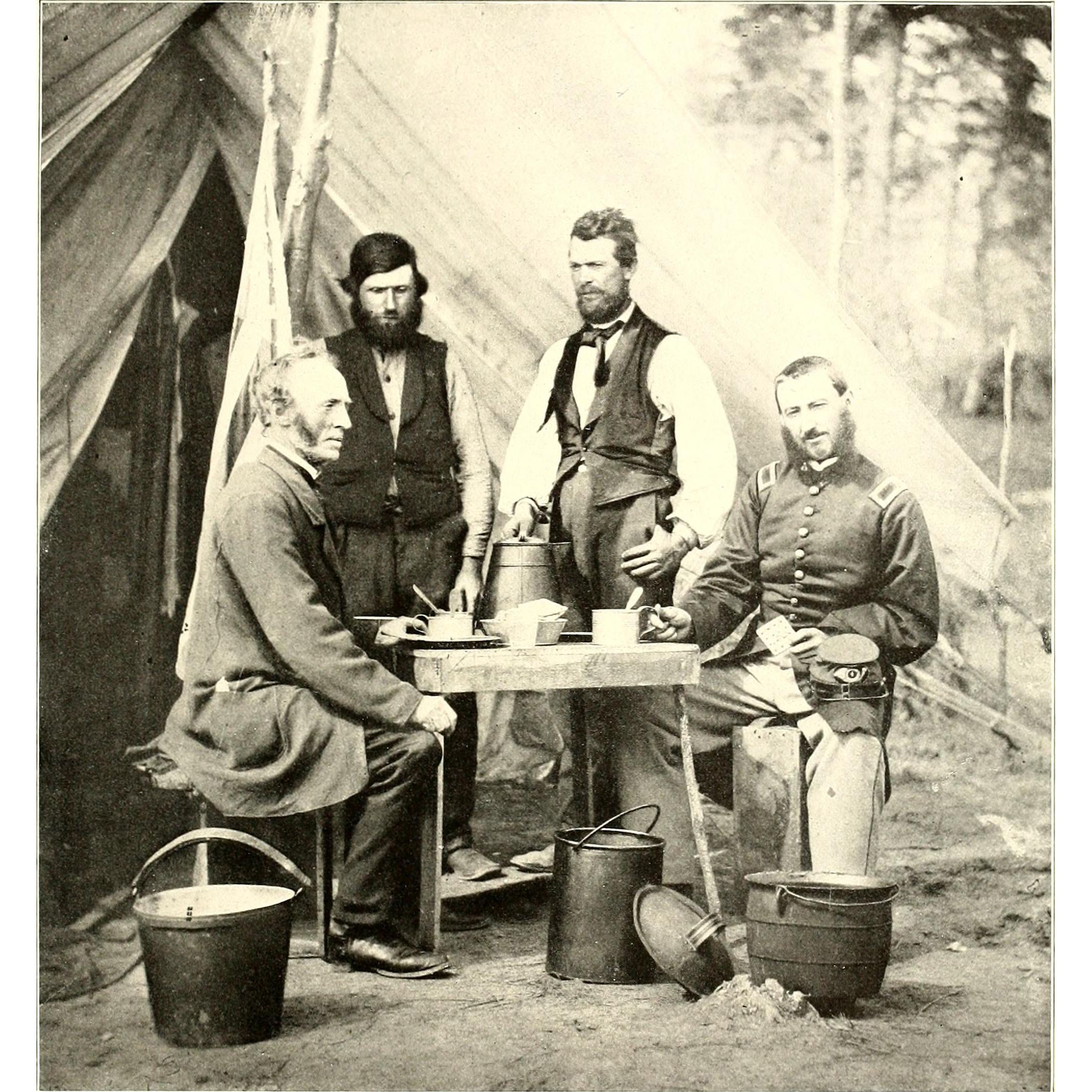 Union soldiers sit with their coffee in tin cups, their hard-tack, and a kettle at their feet.