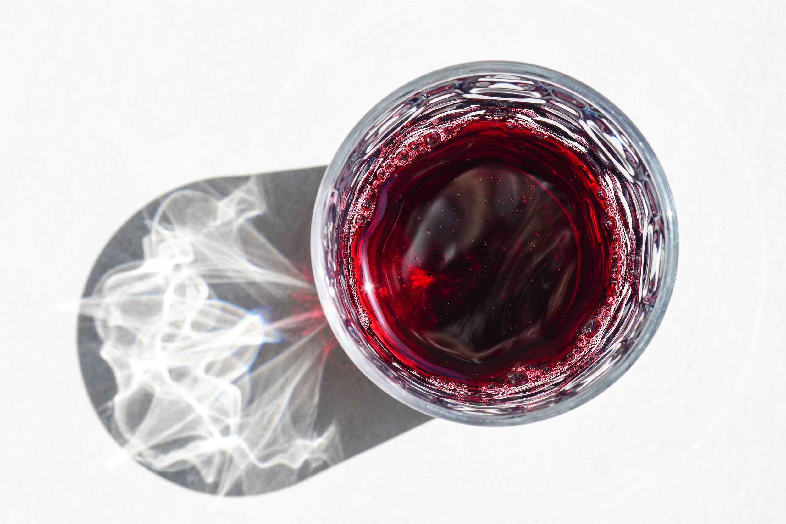 red wine in glass with reflection of glass