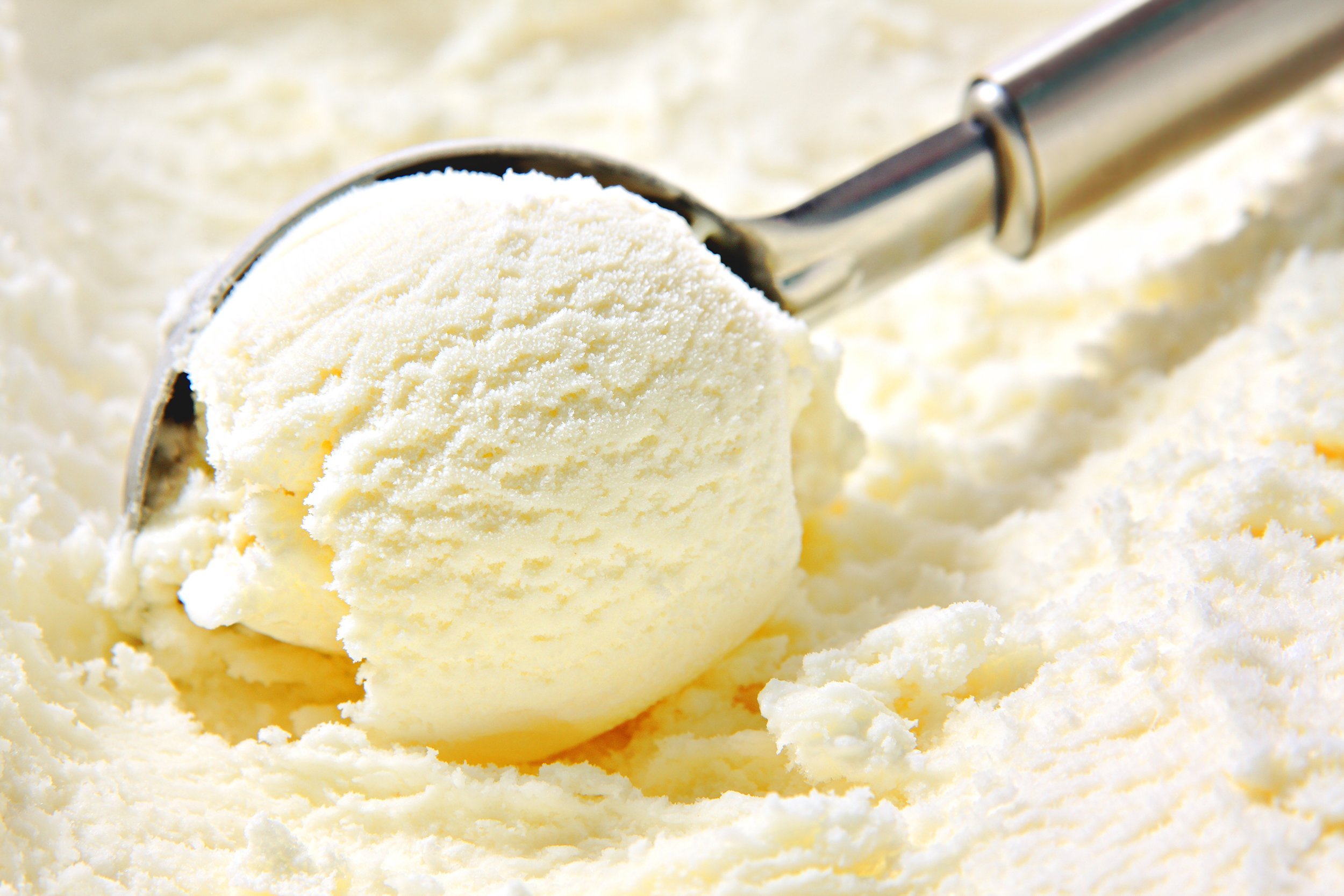 vanilla ice cream scooped out of a container