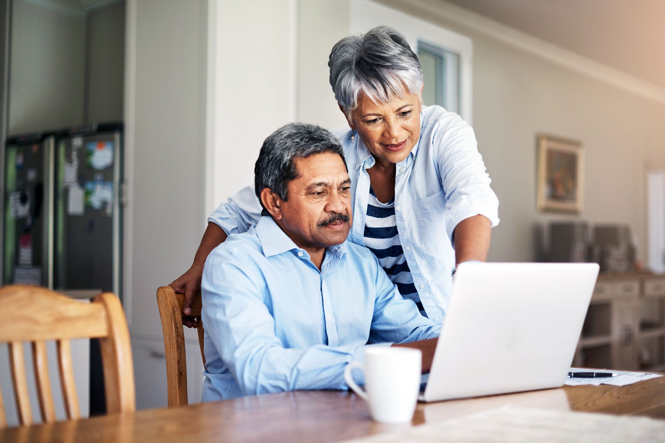 senior couple looking at computer