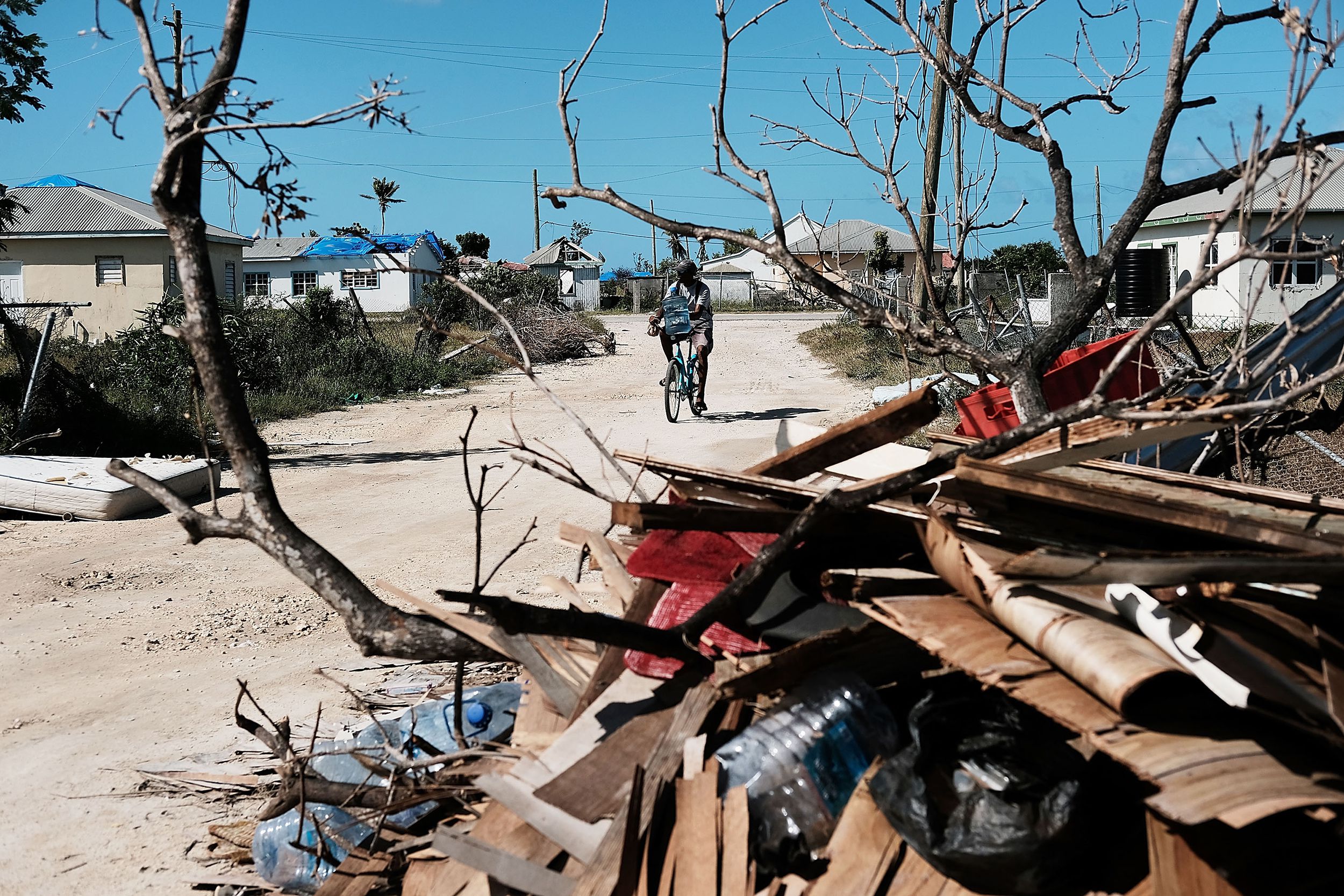 Debris from damaged homes lines a street on the nearly destroyed island of Barbuda on December 8, 2017 in Cordington, Barbuda.