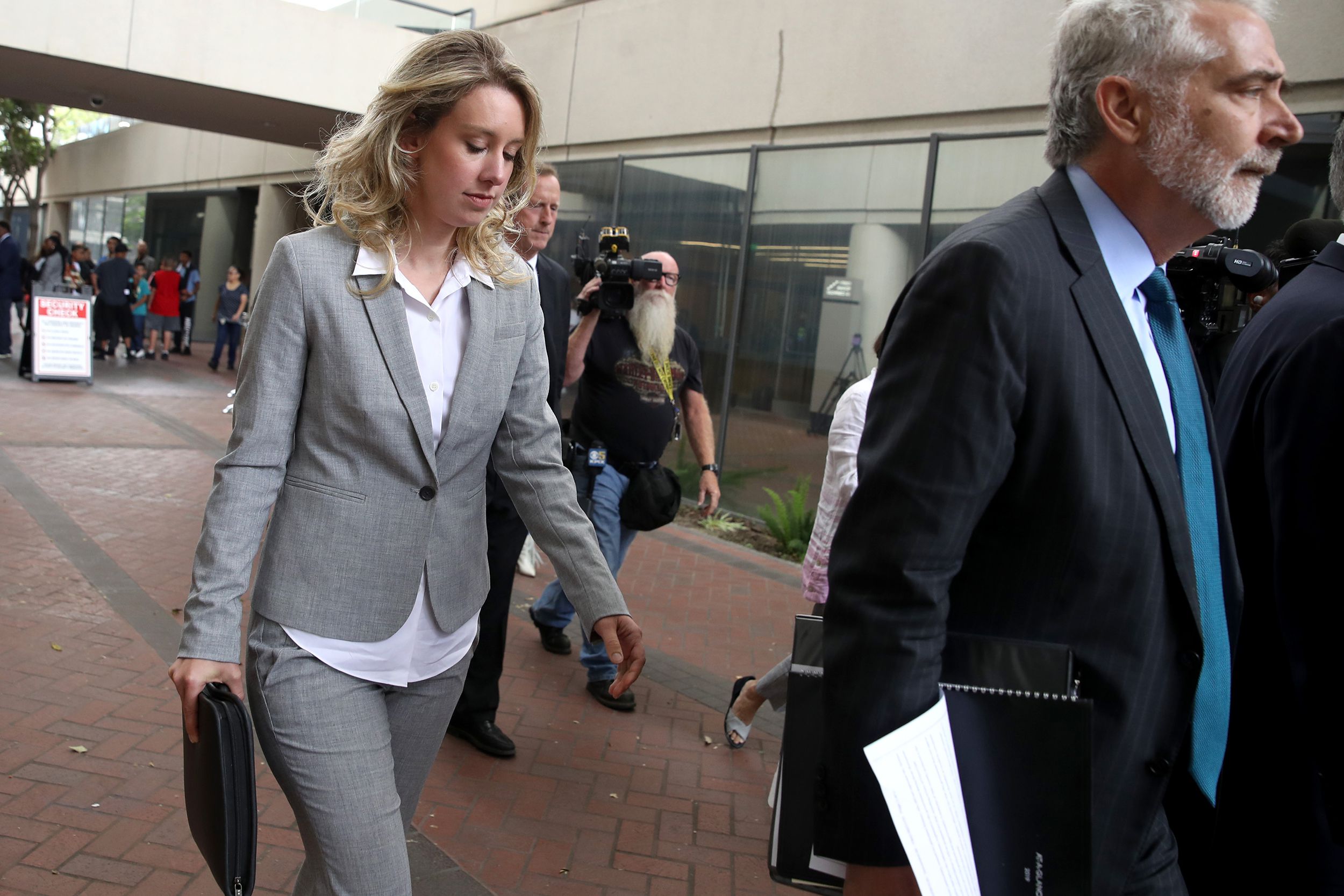 Former Theranos founder and CEO Elizabeth Holmes (L) leaves the Robert F. Peckham U.S. Federal Court on June 28, 2019 in San Jose, California.