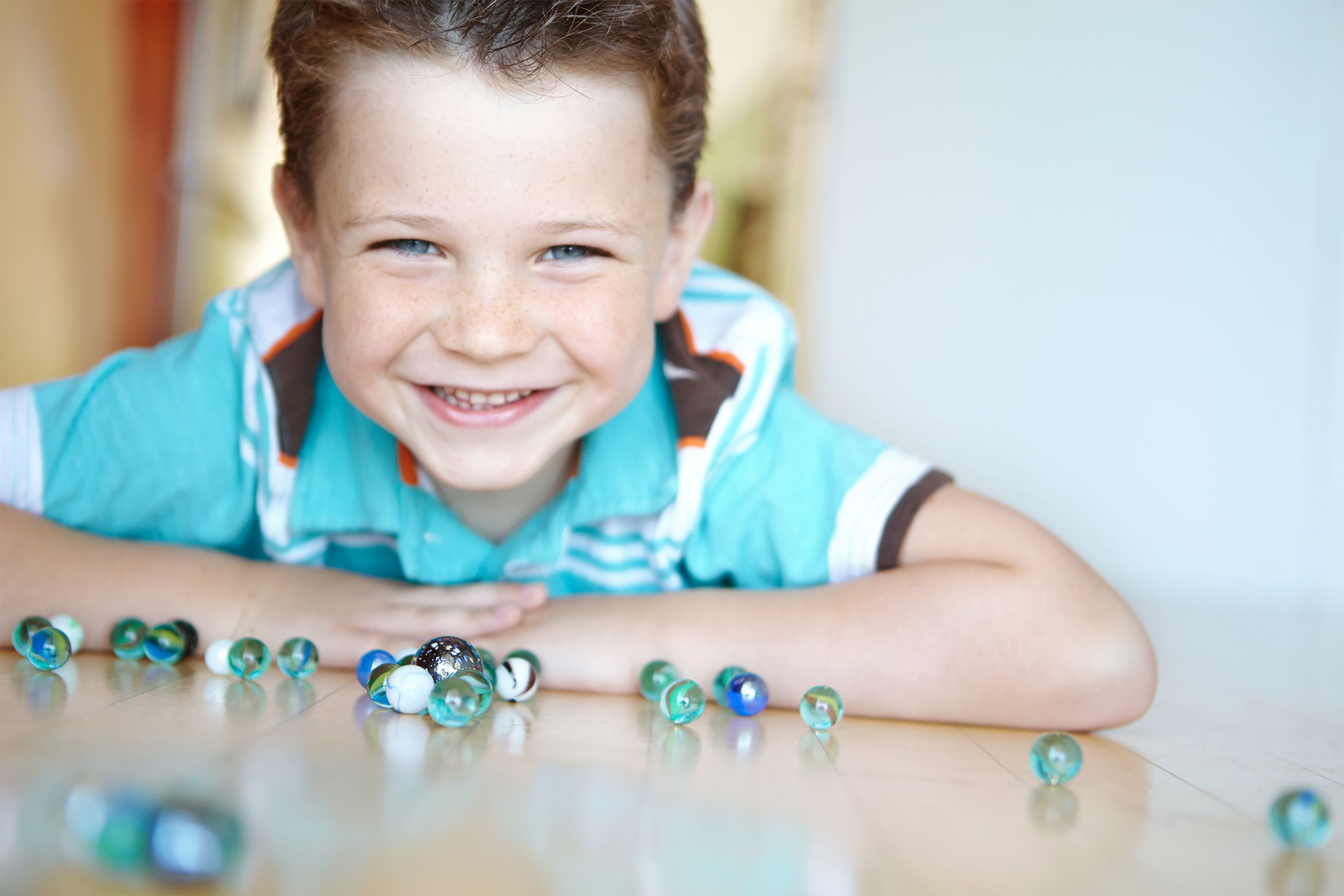 Child with collection of marbles