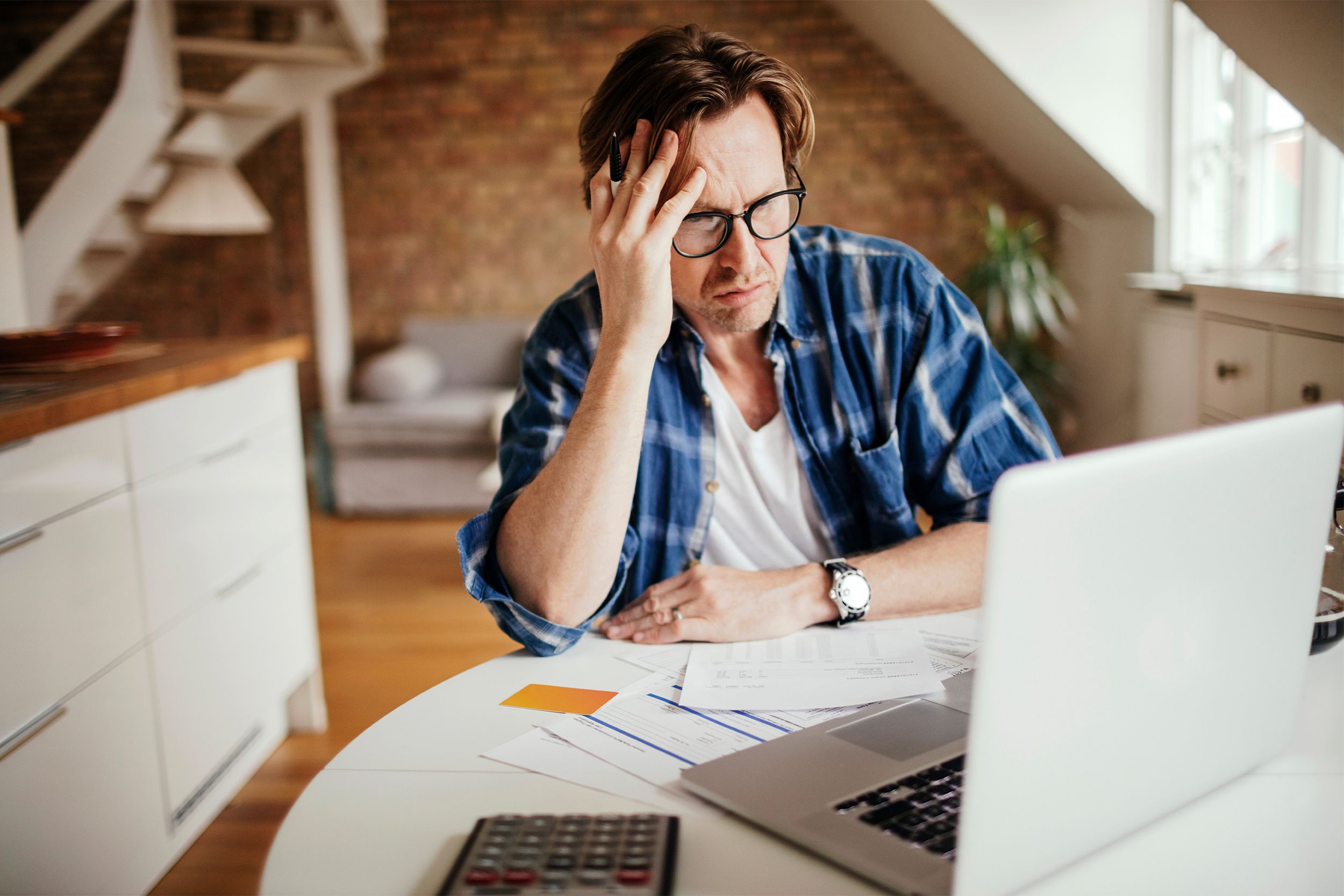 Stressed middle aged man working