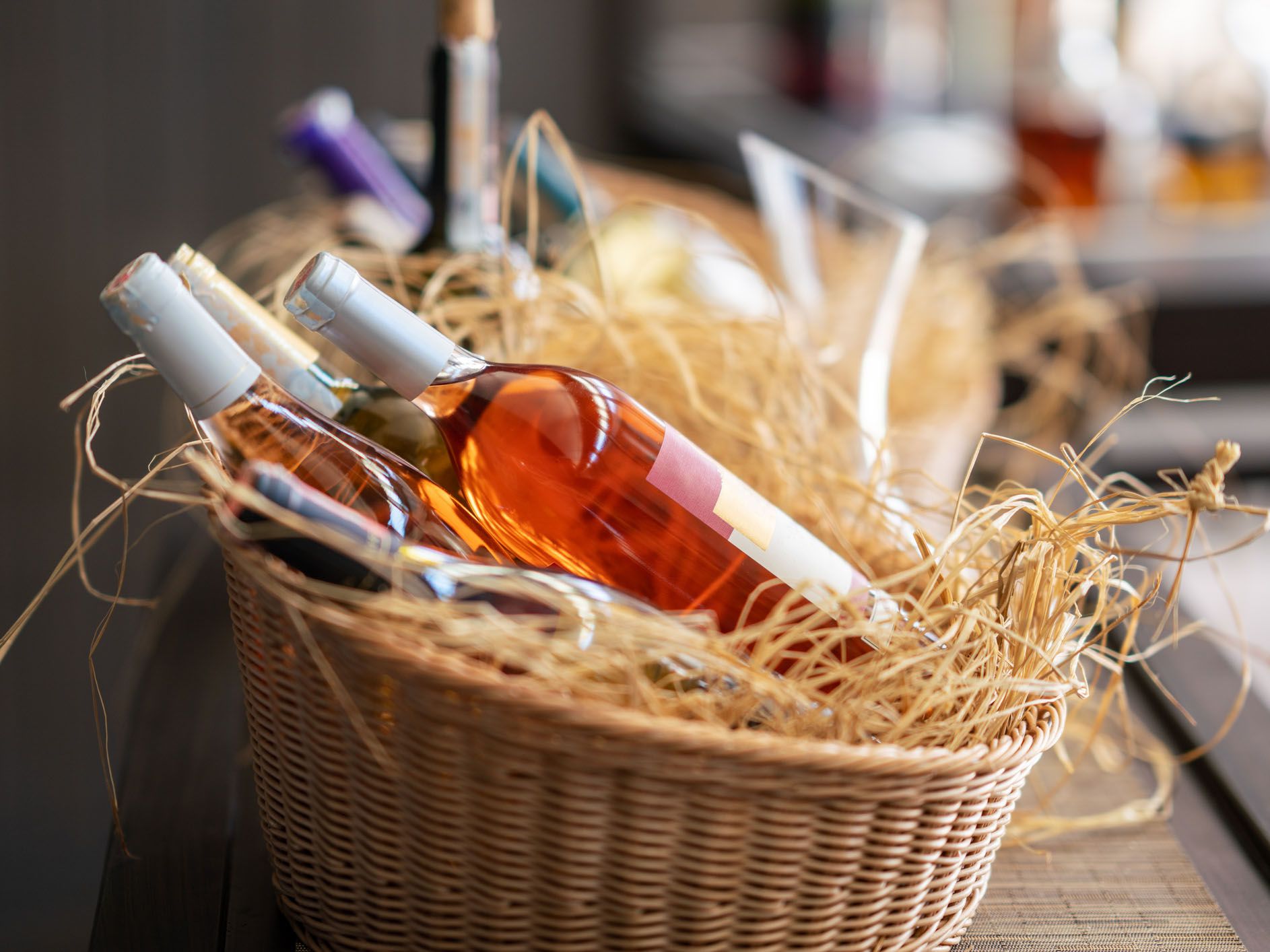 Four wine bottles in a gift basket