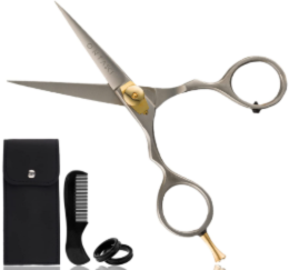 A pair of professional hair cutting scissors is shown with a black carrying case, a small comb, and two black finger inserts arranged below it.