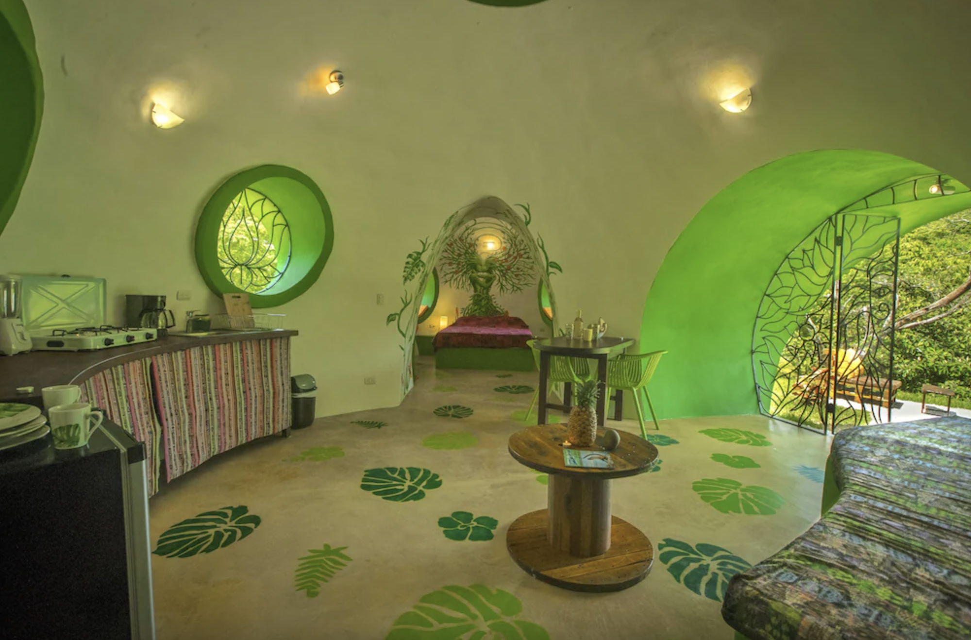 Green Moon Lodge Interior: kitchen, bed, door to outside