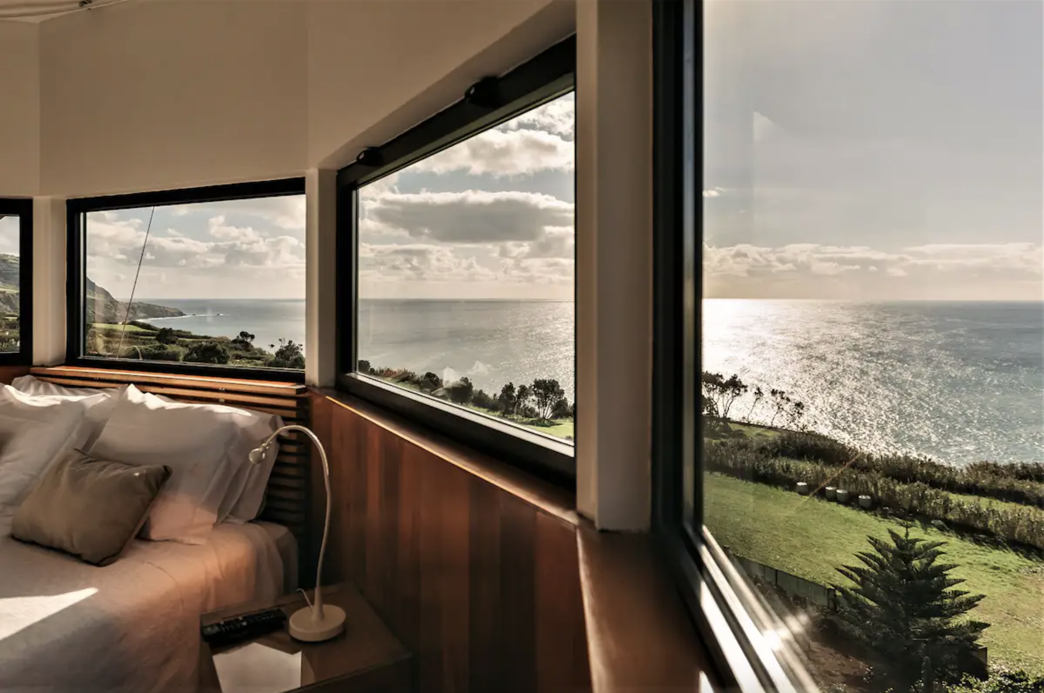 Flea Windmill Interior: bed with window view to the sea