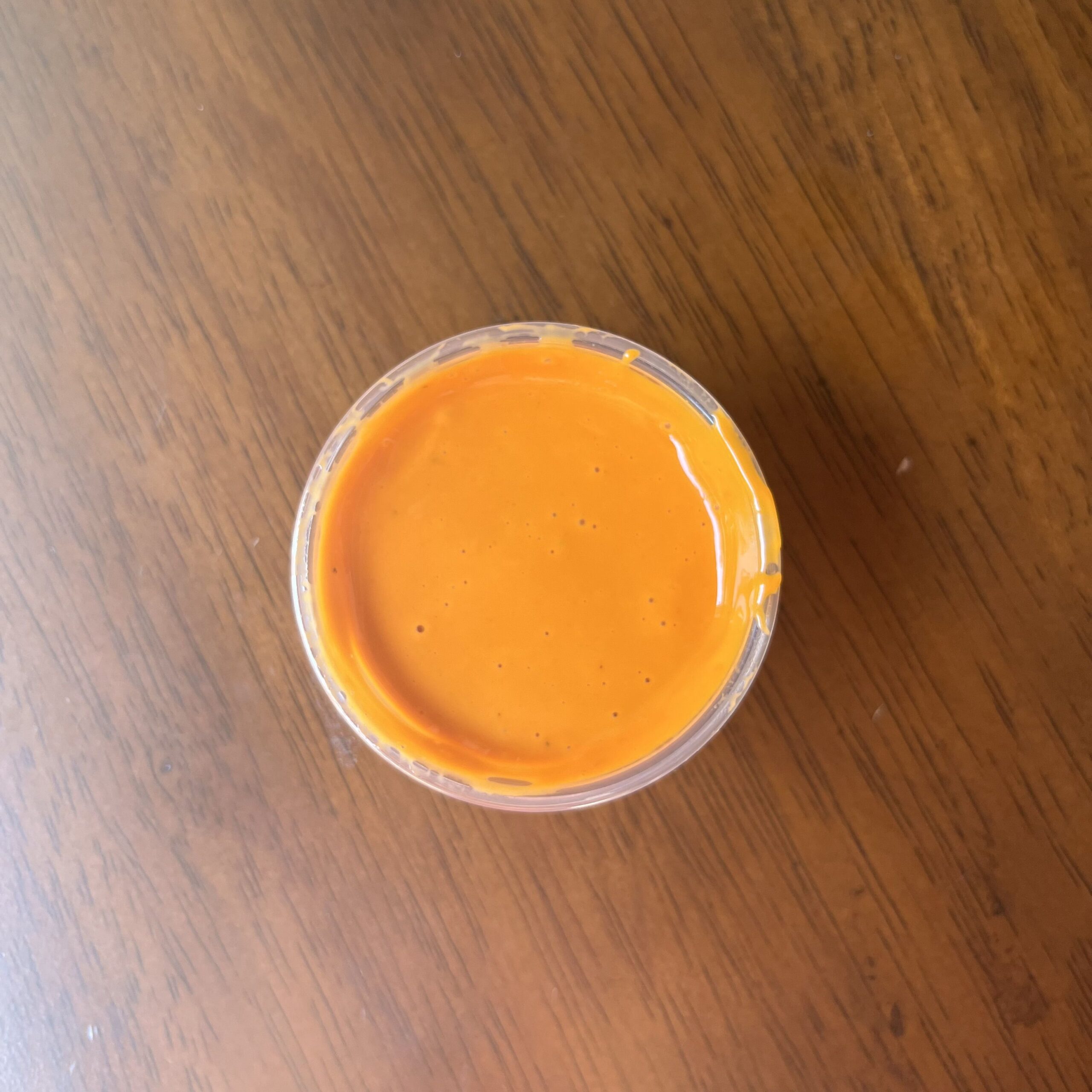 Open container of Zaxby's Buffalo Garlic sauce